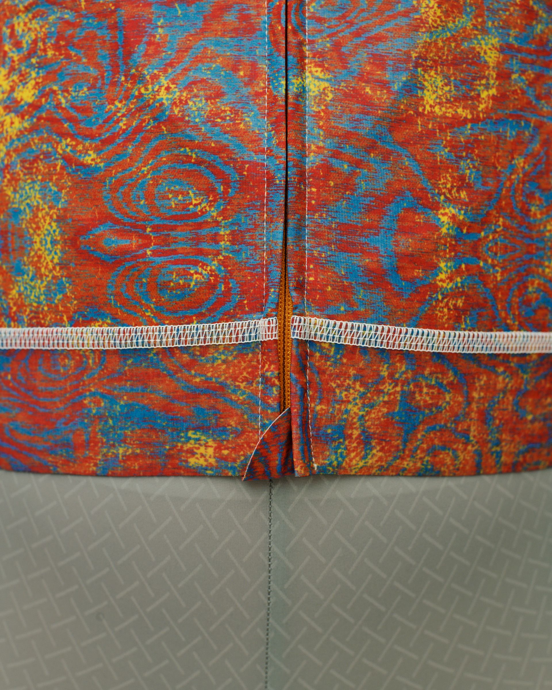 Breakfast Club collection garments with red, blue and yellow swirl pattern and grey geometric print detail