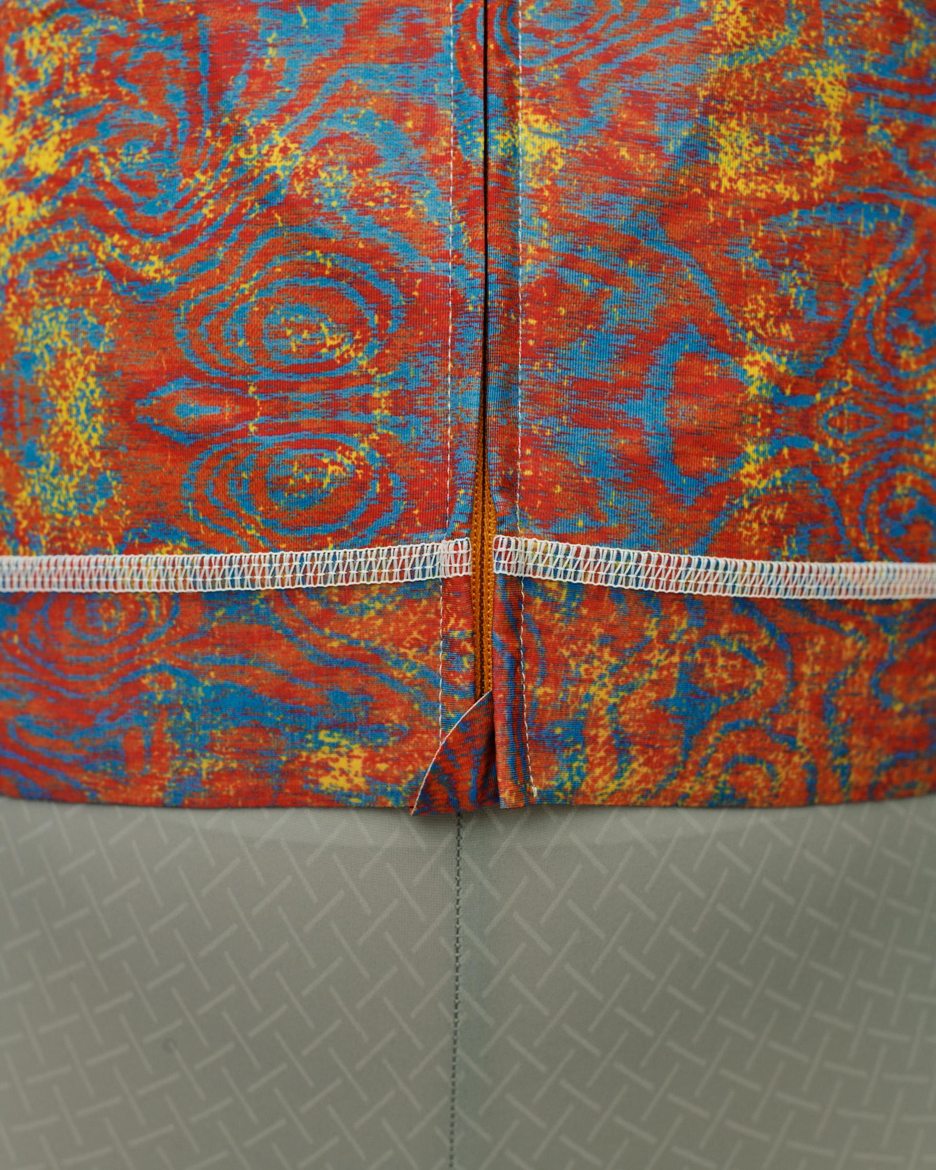 Breakfast Club collection garments with red, blue and yellow swirl pattern and grey geometric print detail