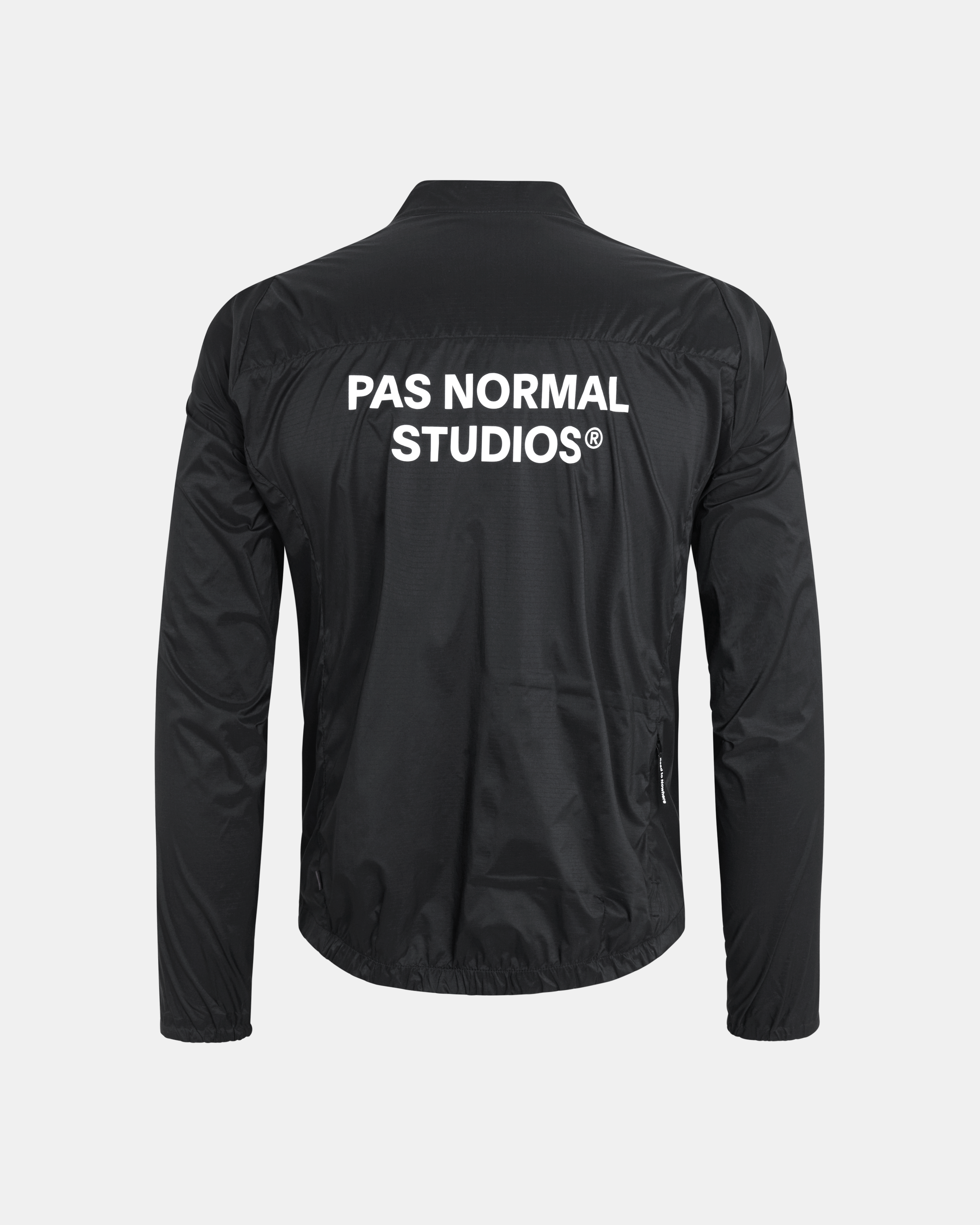 Black Essential insulated cycling jacket, rear view with white back logo