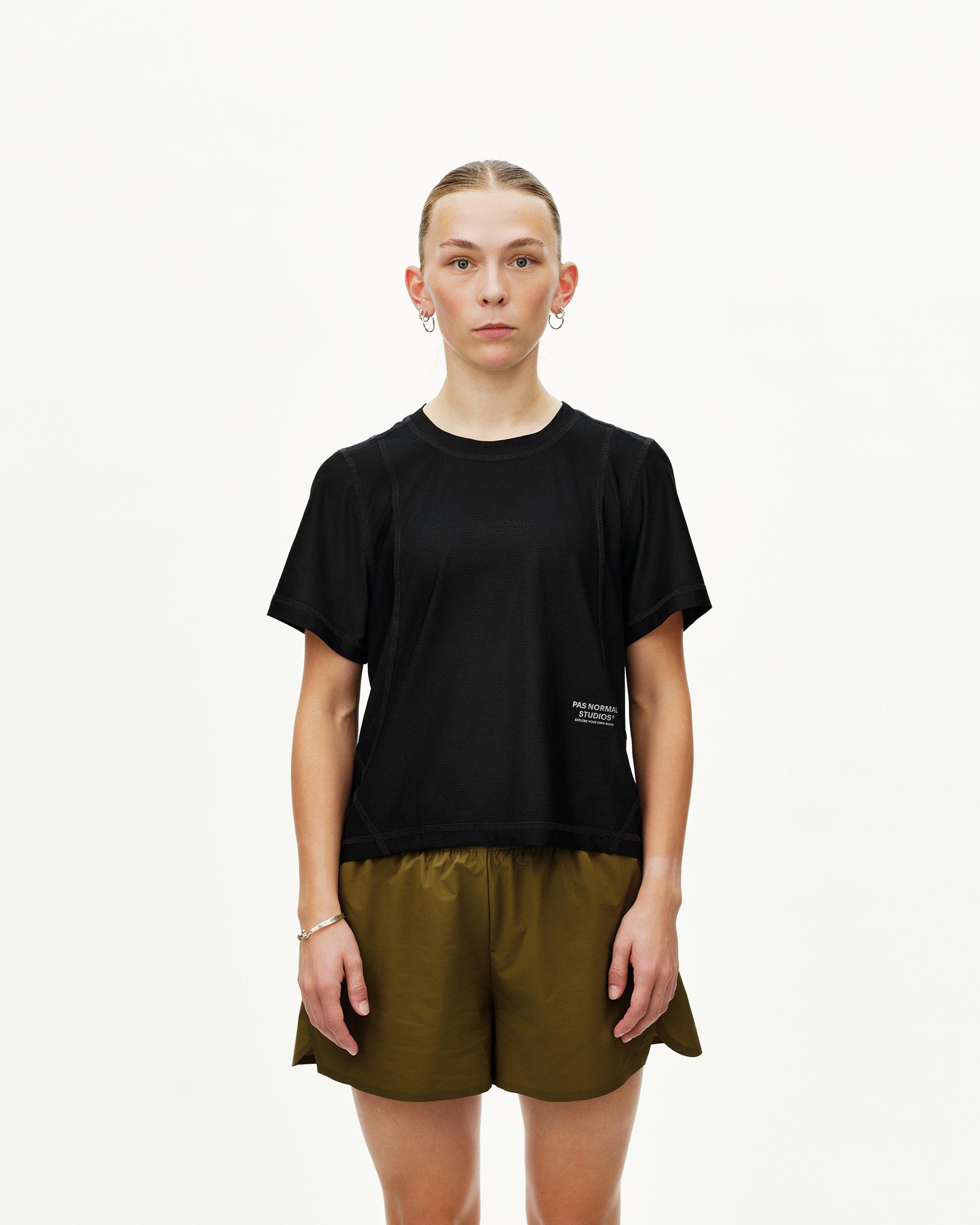Black Balance T-Shirt on model, front view with contrast stitching and small chest logo print