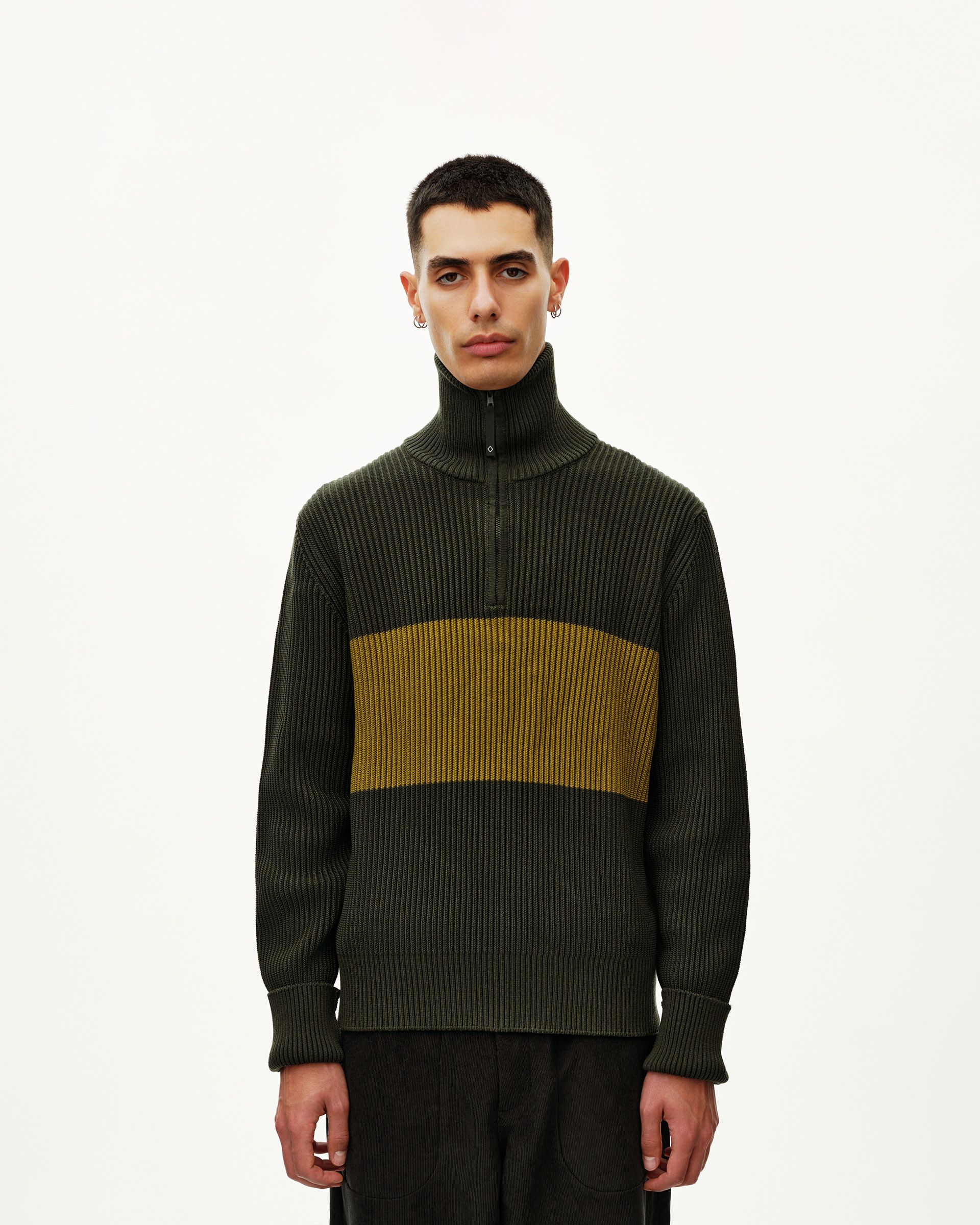 Olive Off-Race Merino Knit Half-Zip sweater on model, front view with yellow contrast chest stripe