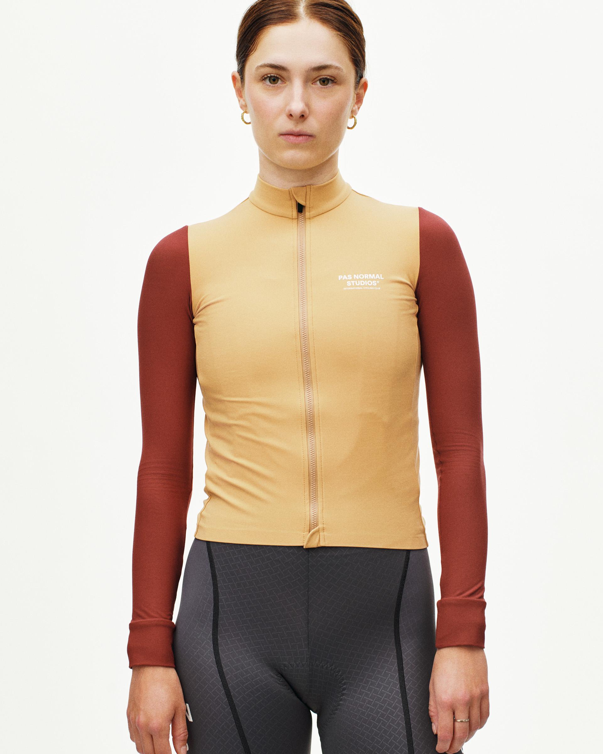 Yellow Mechanism long sleeve cycling jersey on model with maroon sleeves and full zip