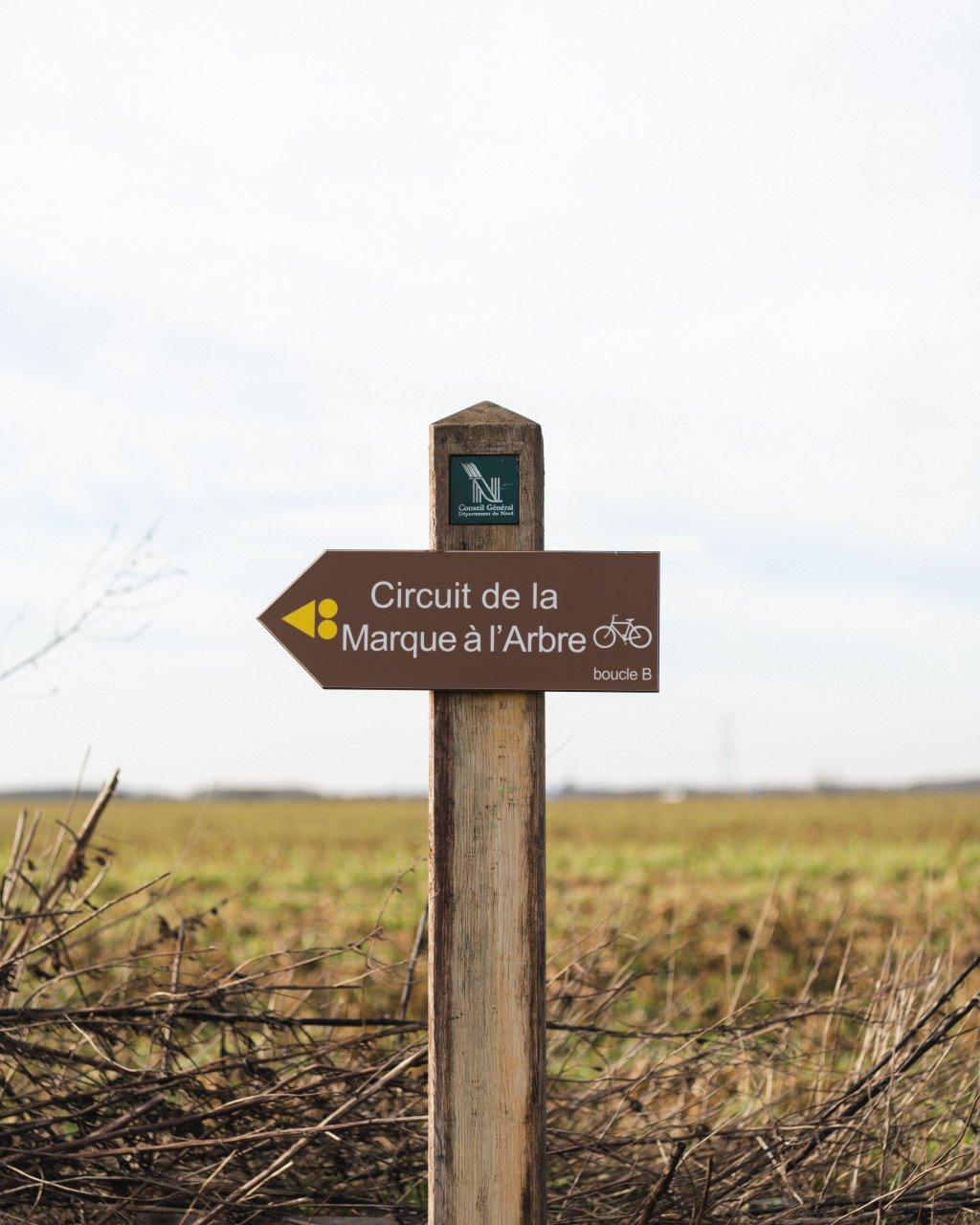 French cycling route directional sign in rural countryside setting