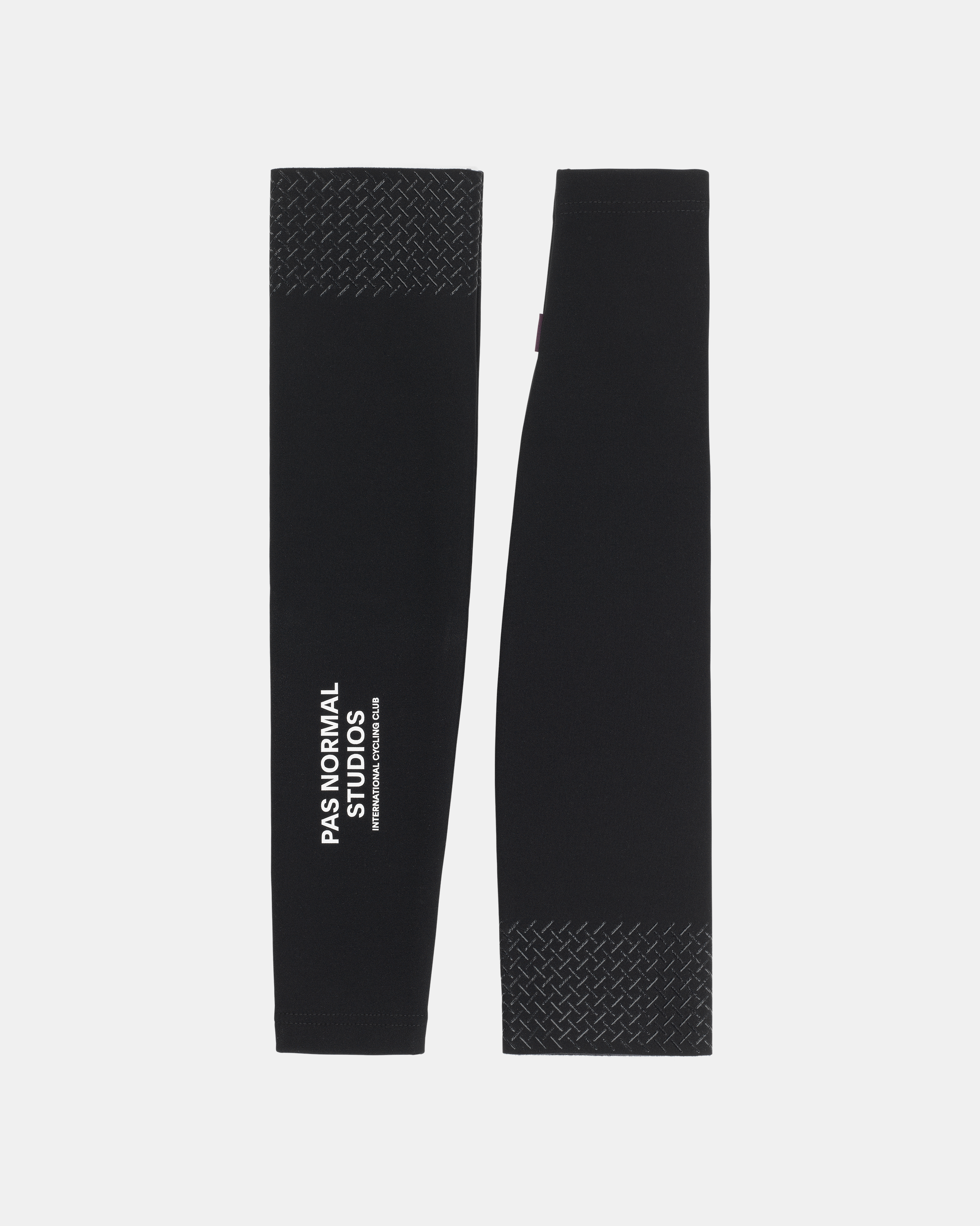 Black Logo arm warmers, flat lay pair with textured silicone grippers