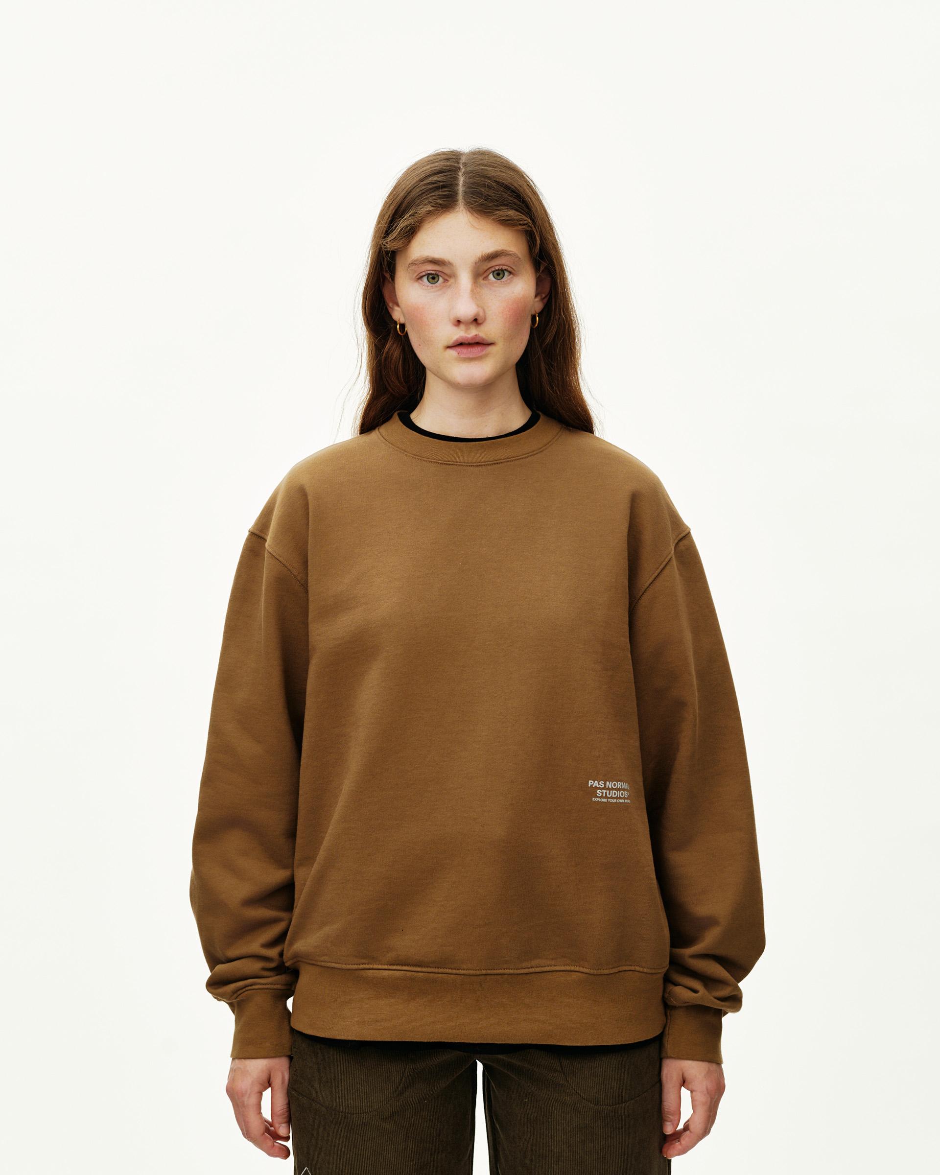Wood brown Off-Race sweatshirt on model, front view with small chest logo print