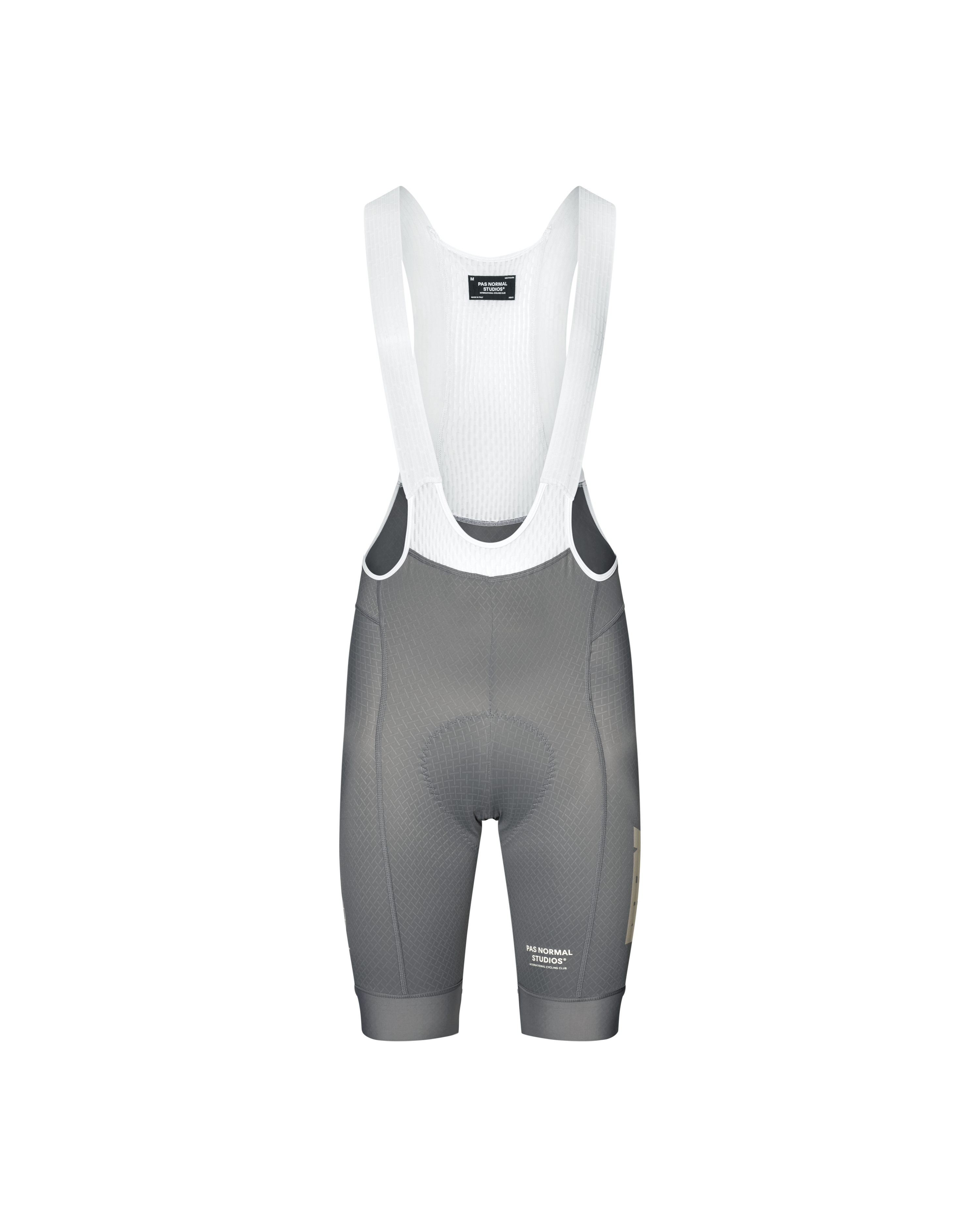 Medium Grey Mechanism cycling bibs, front flat lay with white ribbed bib straps and gold side logo