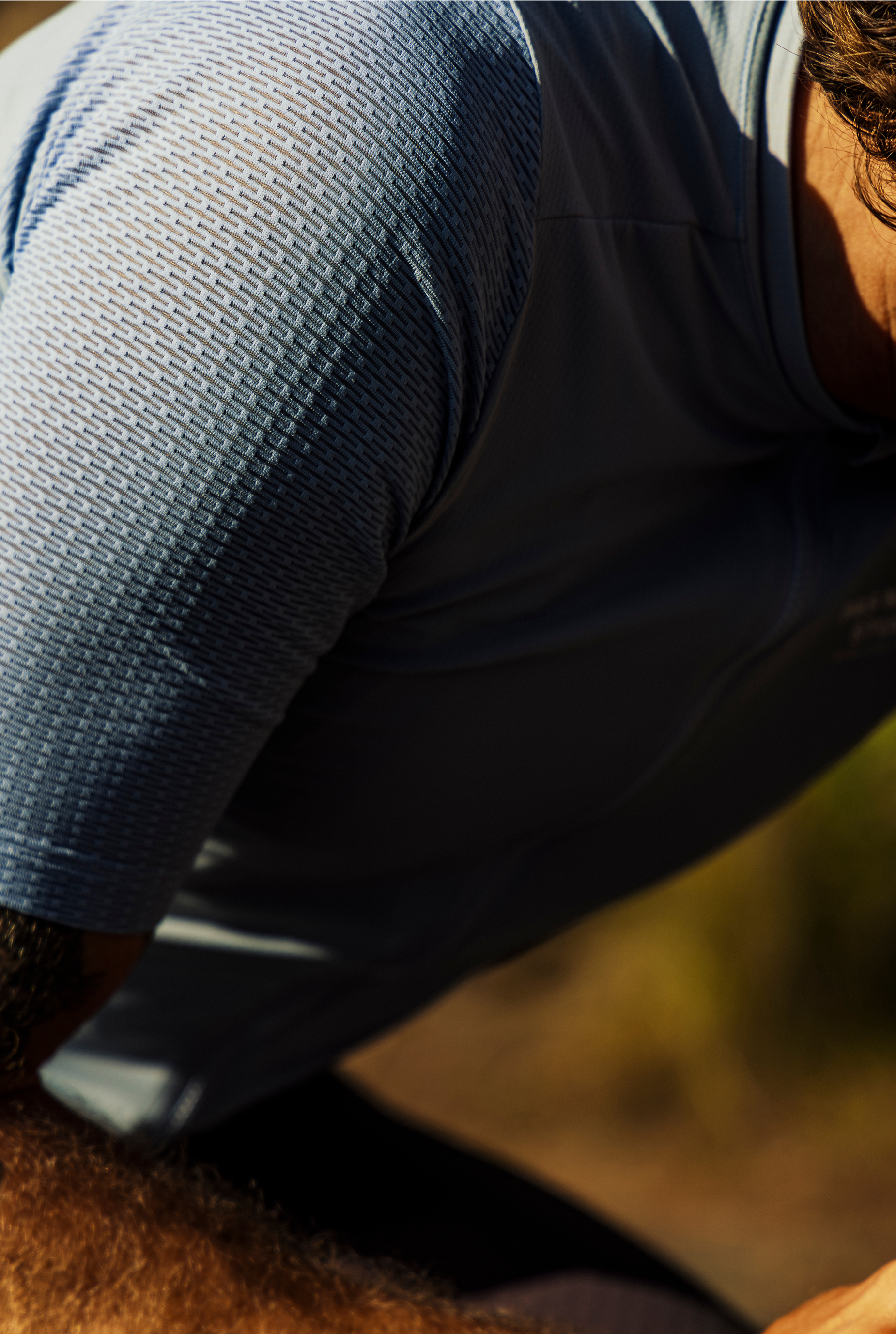 Mesh fabric sleeve with textured weave pattern for enhanced ventilation and cooling