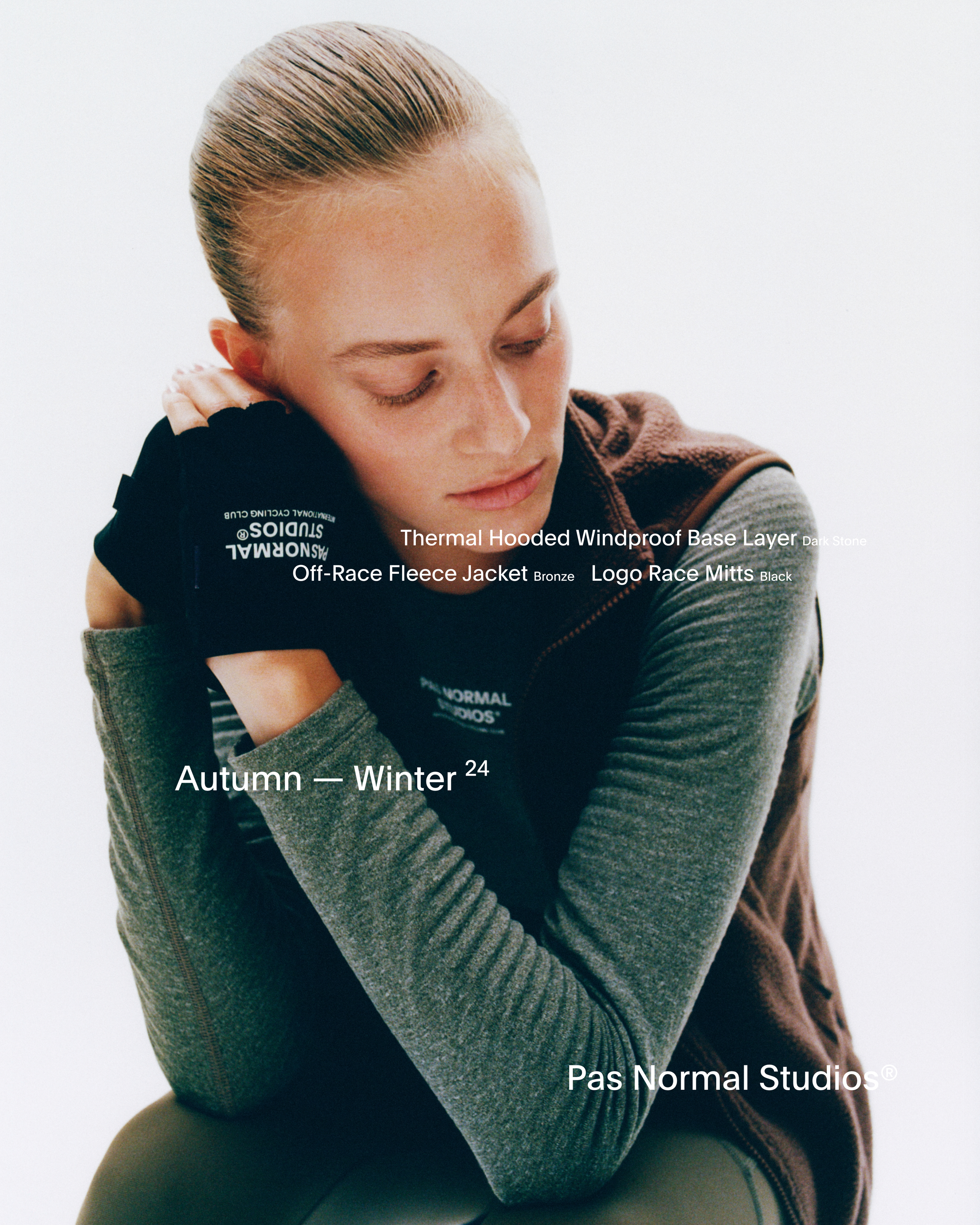 Model wearing Women's Thermal Hooded Windproof Base Layer in dark grey, Off-Race Fleece Jacket, and Logo Race Mitts