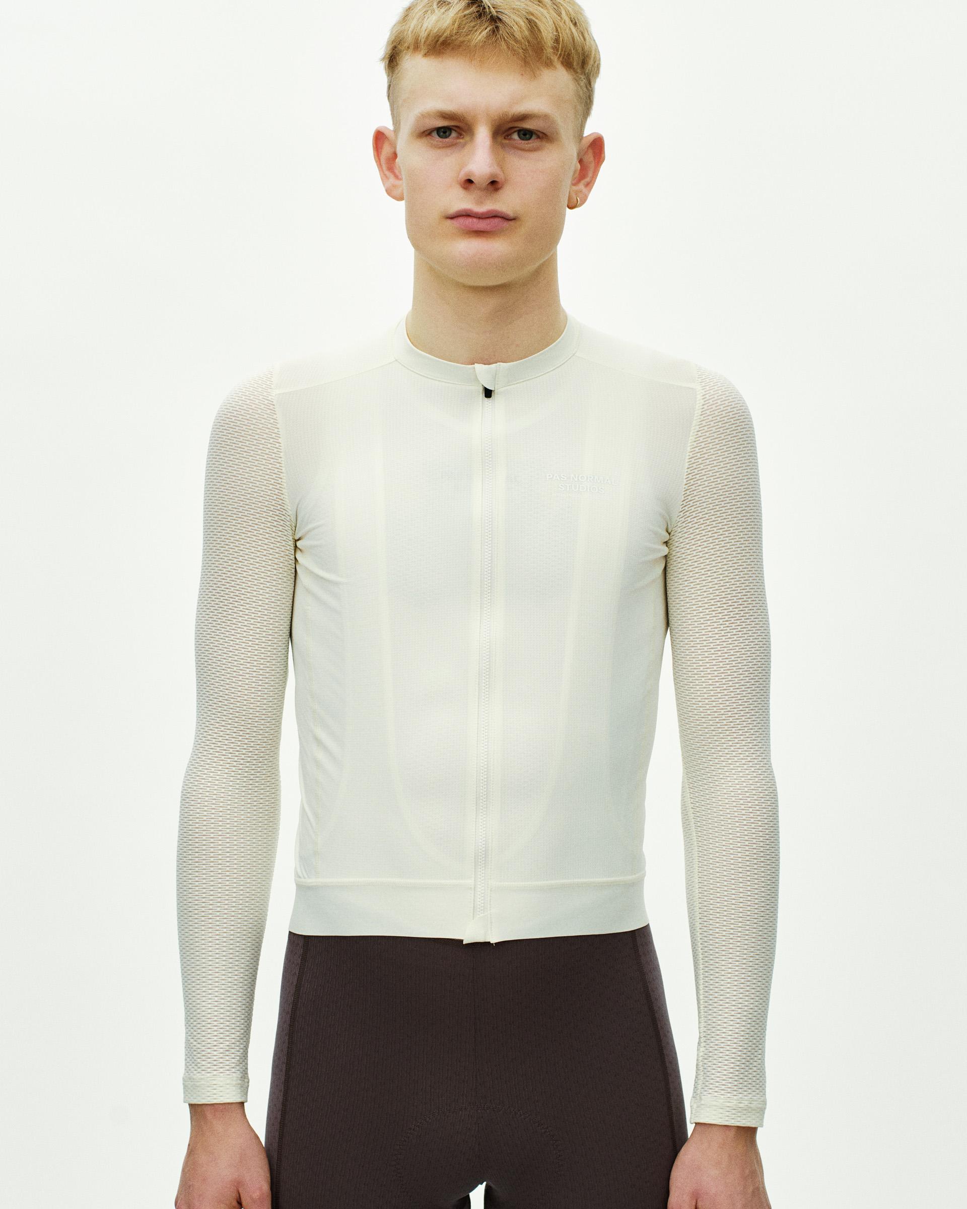 Off White Essential Light long sleeve cycling jersey on model with mesh sleeves