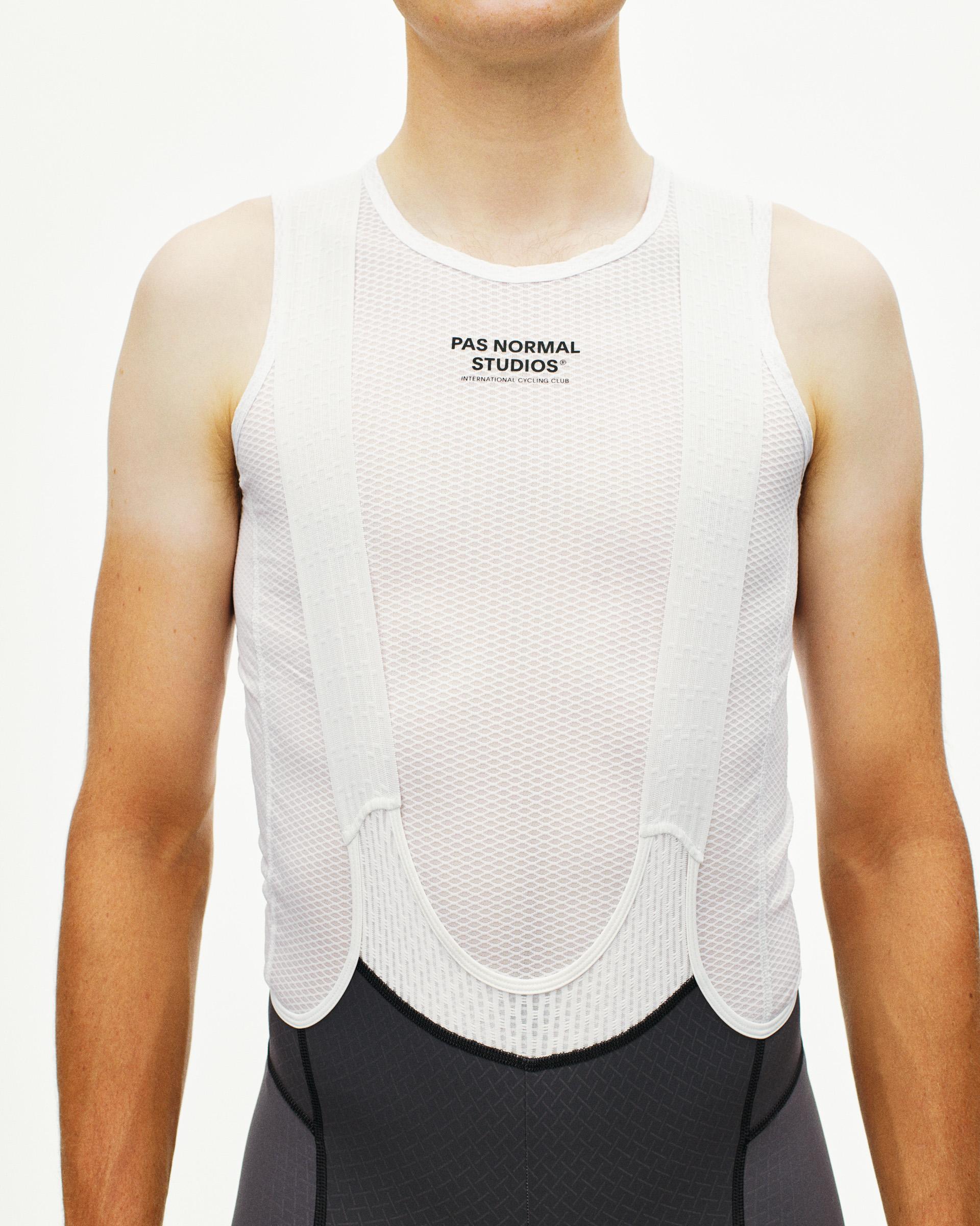 White Mechanism sleeveless cycling base layer on model, front view with mesh construction