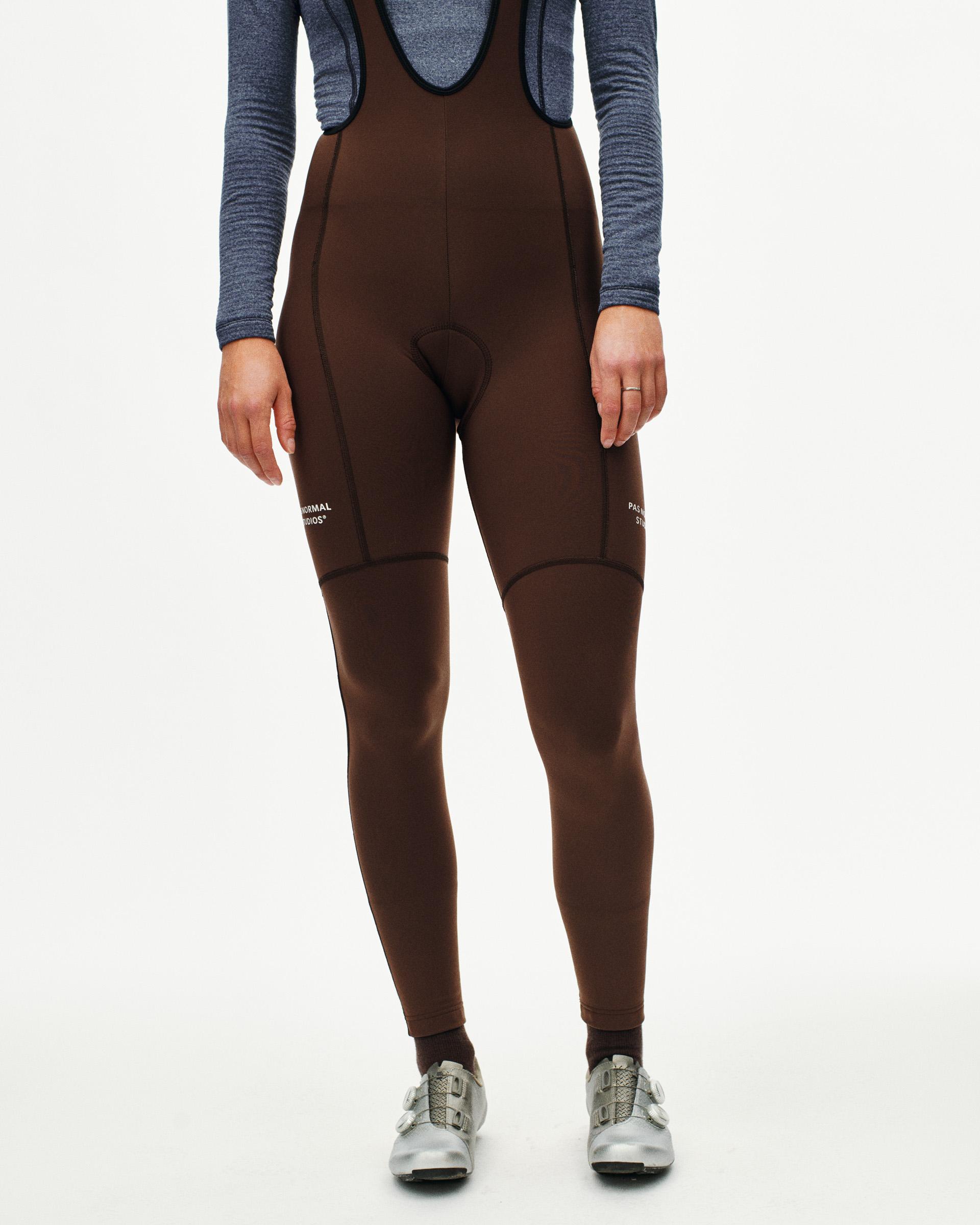 Brown Essential Thermal Long cycling bibs on model with bib straps and knee warmers