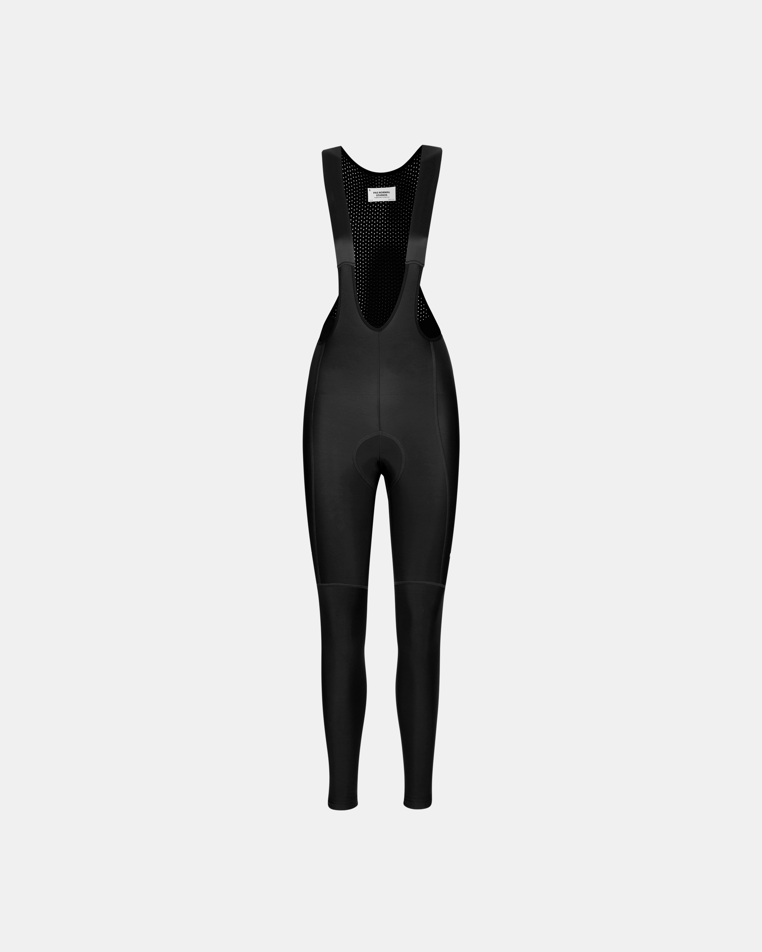 Black Essential women's thermal long cycling bib tights, front flat lay with perforated mesh bib panel