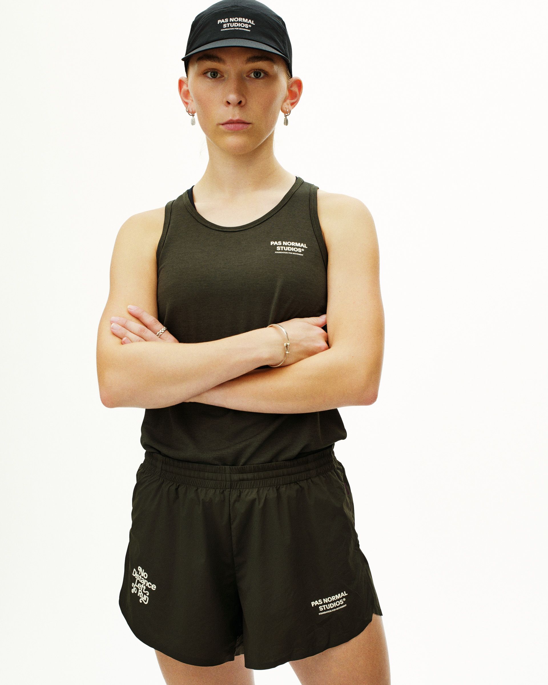 Dark Olive Balance women's shorts, front view on model with graphic leg print and elastic waistband