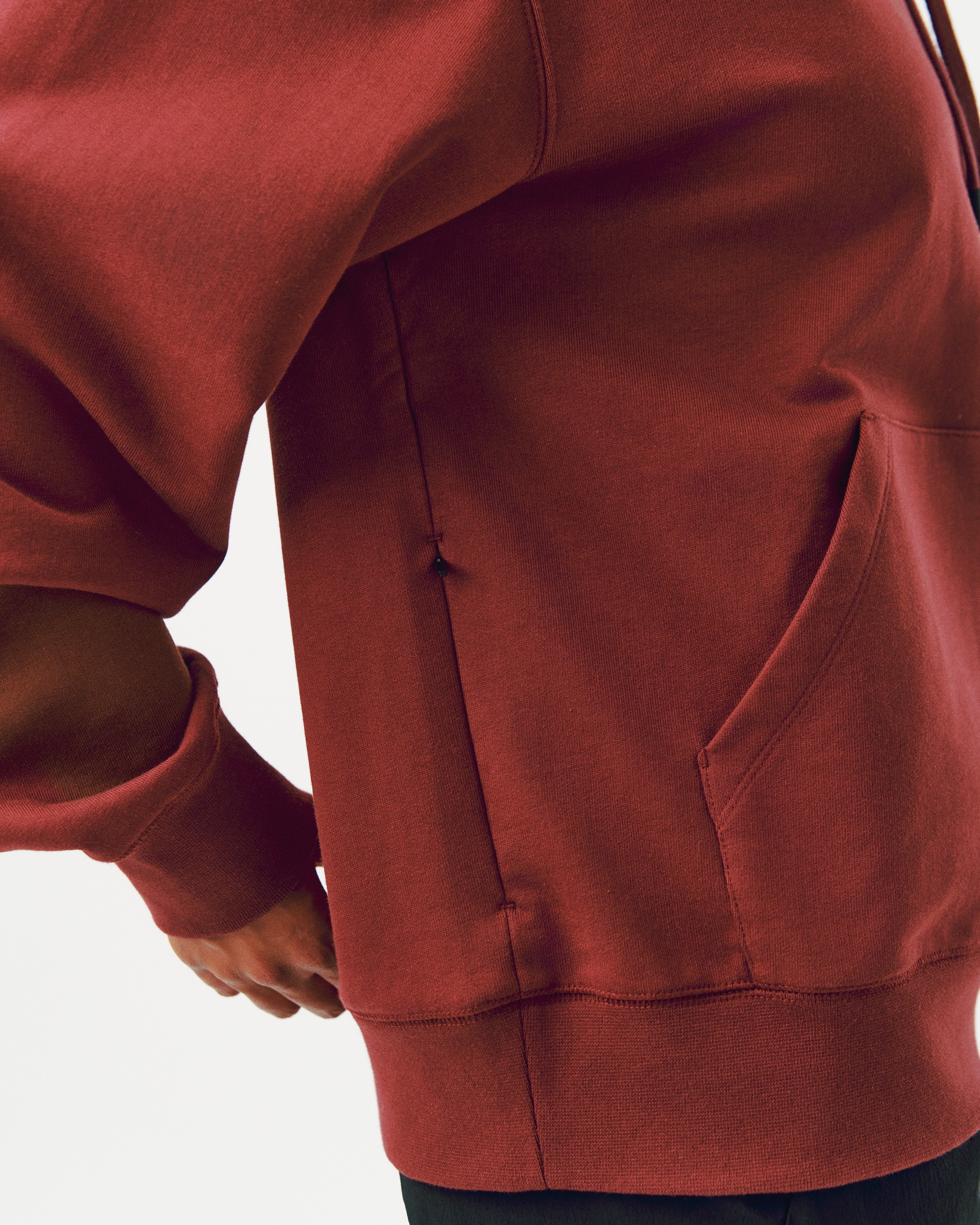 Maroon Off-Race Graphic hoodie on model showing ribbed hem and kangaroo pocket