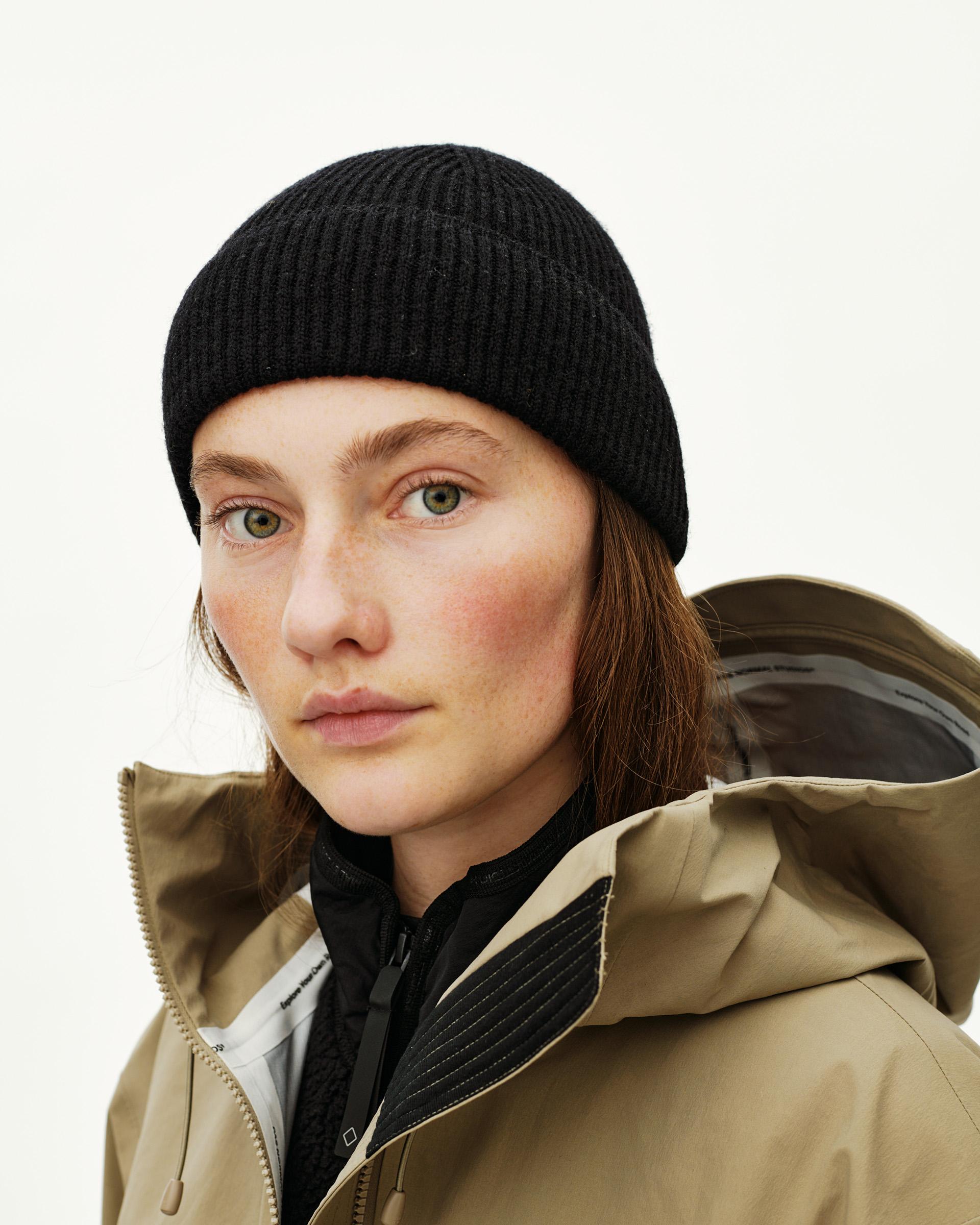 Black Off-Race Merino Knit Beanie on model, front close-up with ribbed cuff