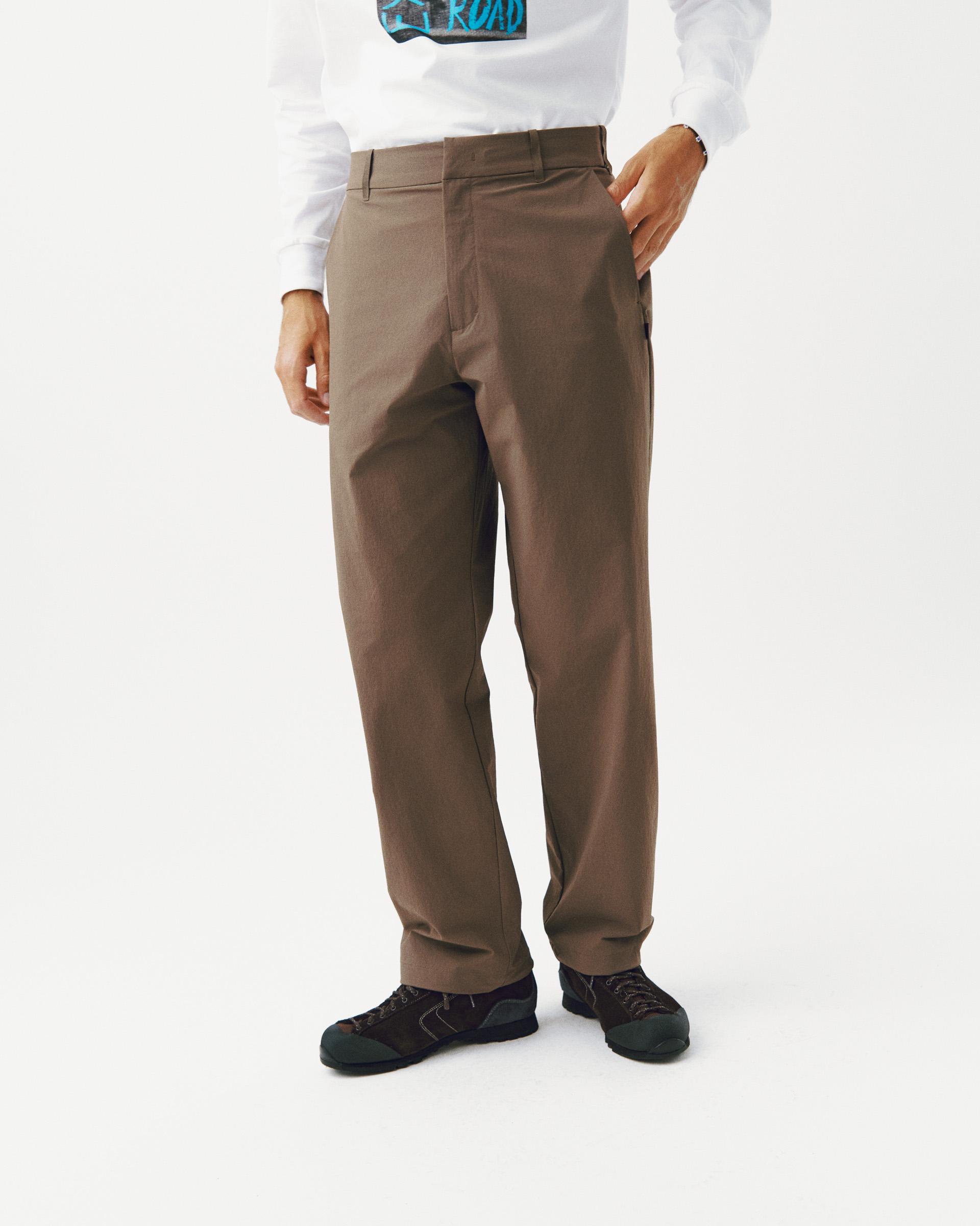 Brown Off-Race Tech pants on model with straight leg and side pockets