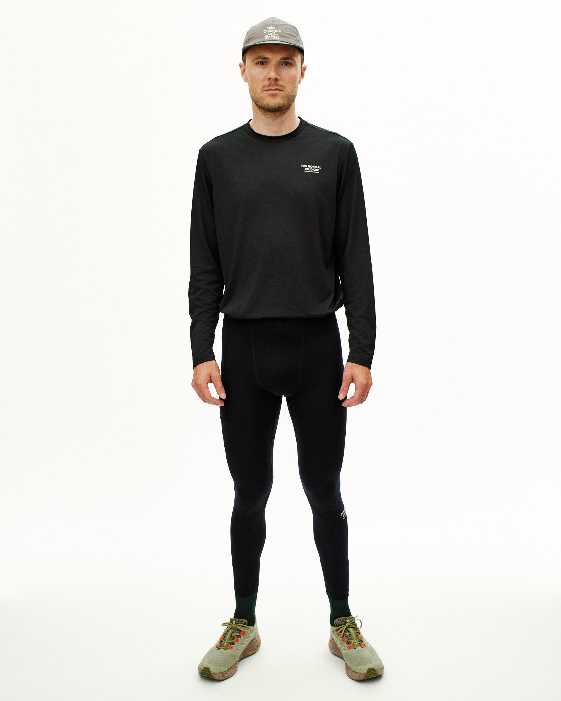 Black Balance long tights on model, front view with elastic waistband