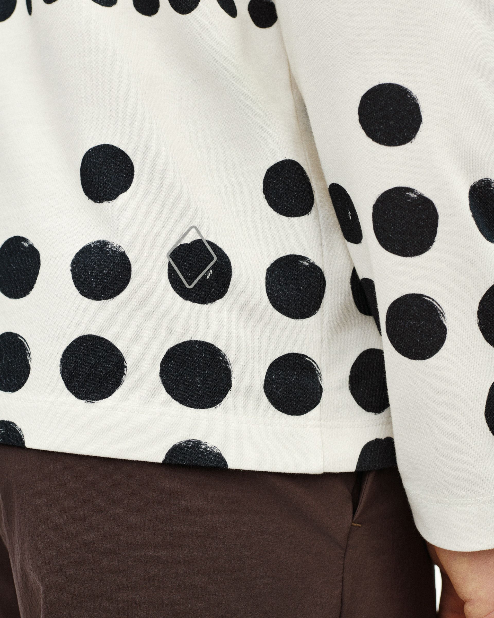 Off White Off-Race Graphic long sleeve t-shirt on model with black polka dot print