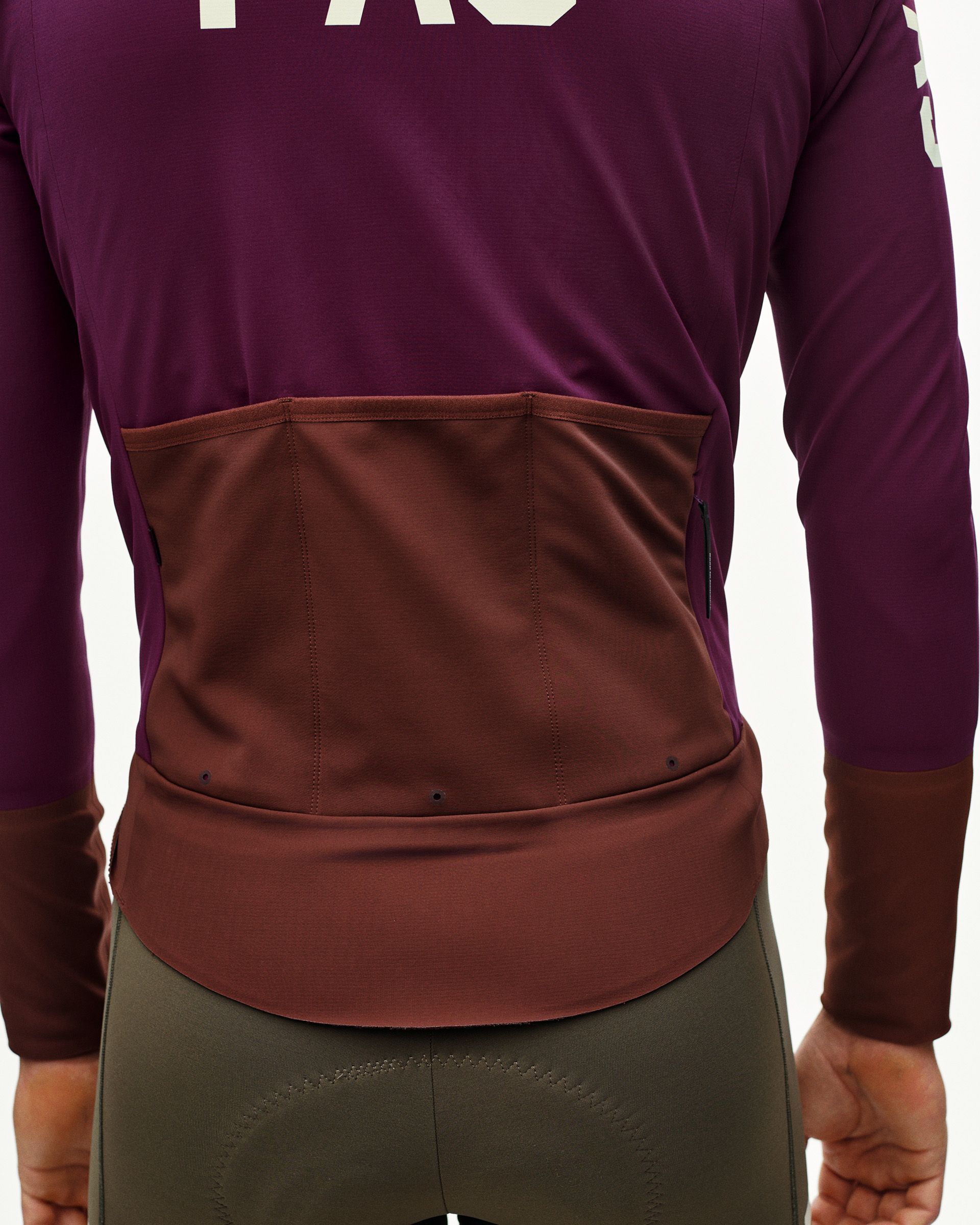 Dark Purple PAS Mechanism Thermal cycling jacket on model, rear detail with contrast brown back panel and pockets