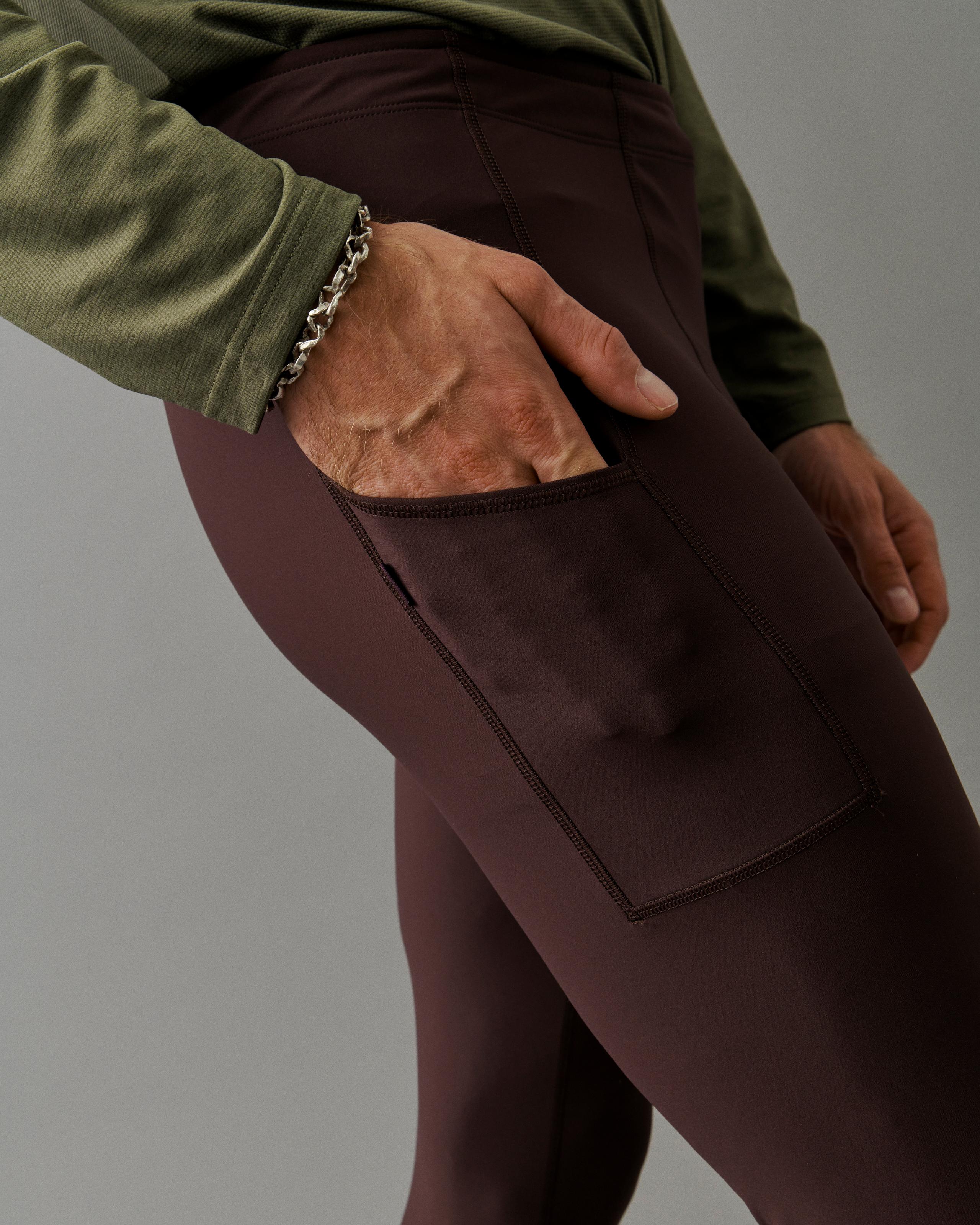 Dark Red Balance long tights on model showing side thigh pocket with contrast stitching