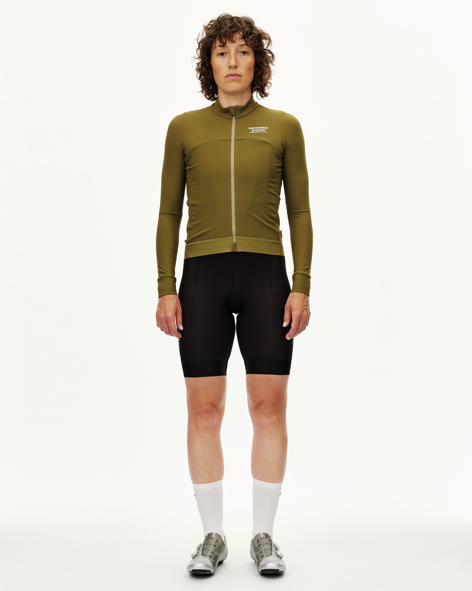 Khaki Green Essential long sleeve cycling jersey on model, front view with white chest logo