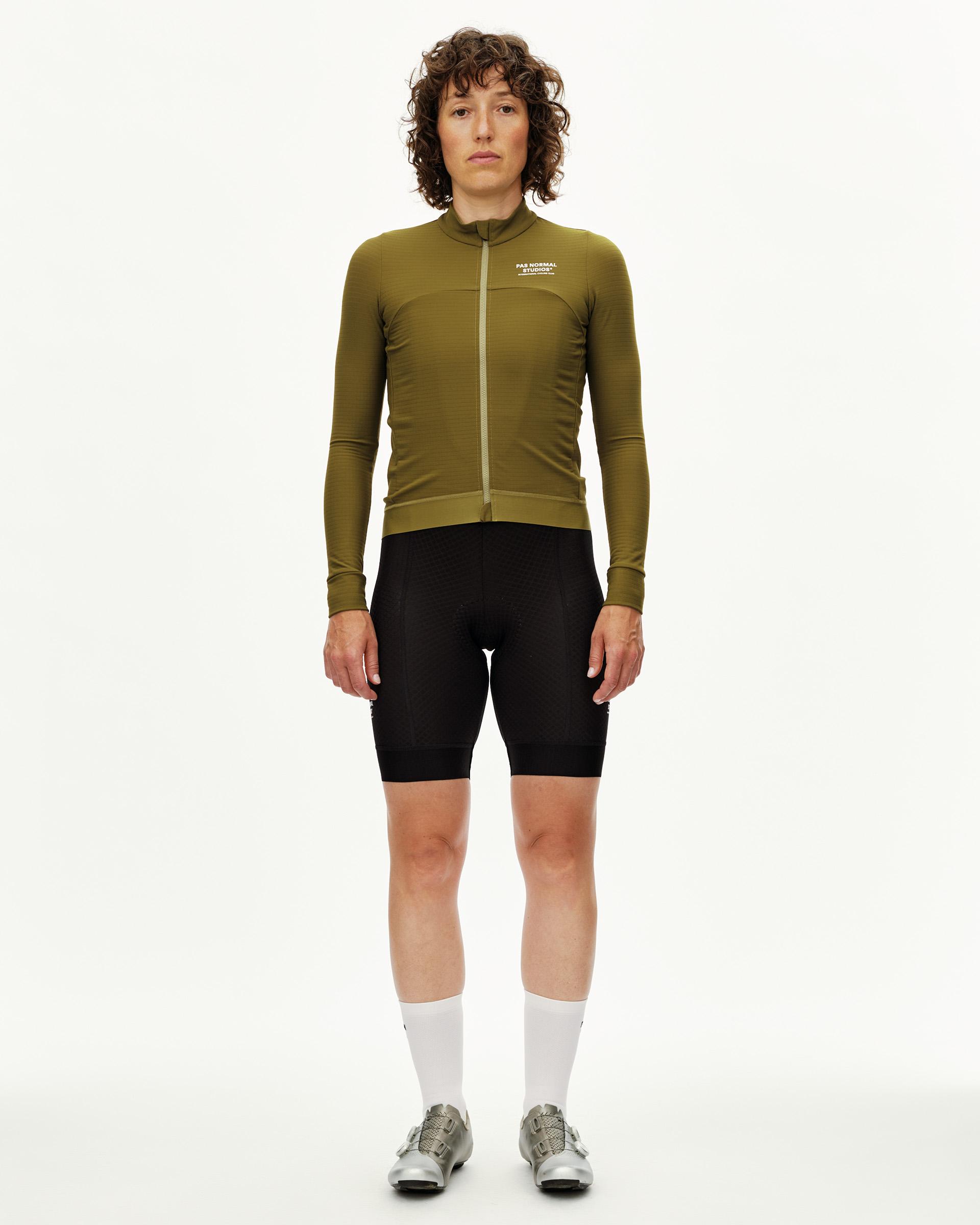 Khaki Green Essential long sleeve cycling jersey on model, front view with white chest logo
