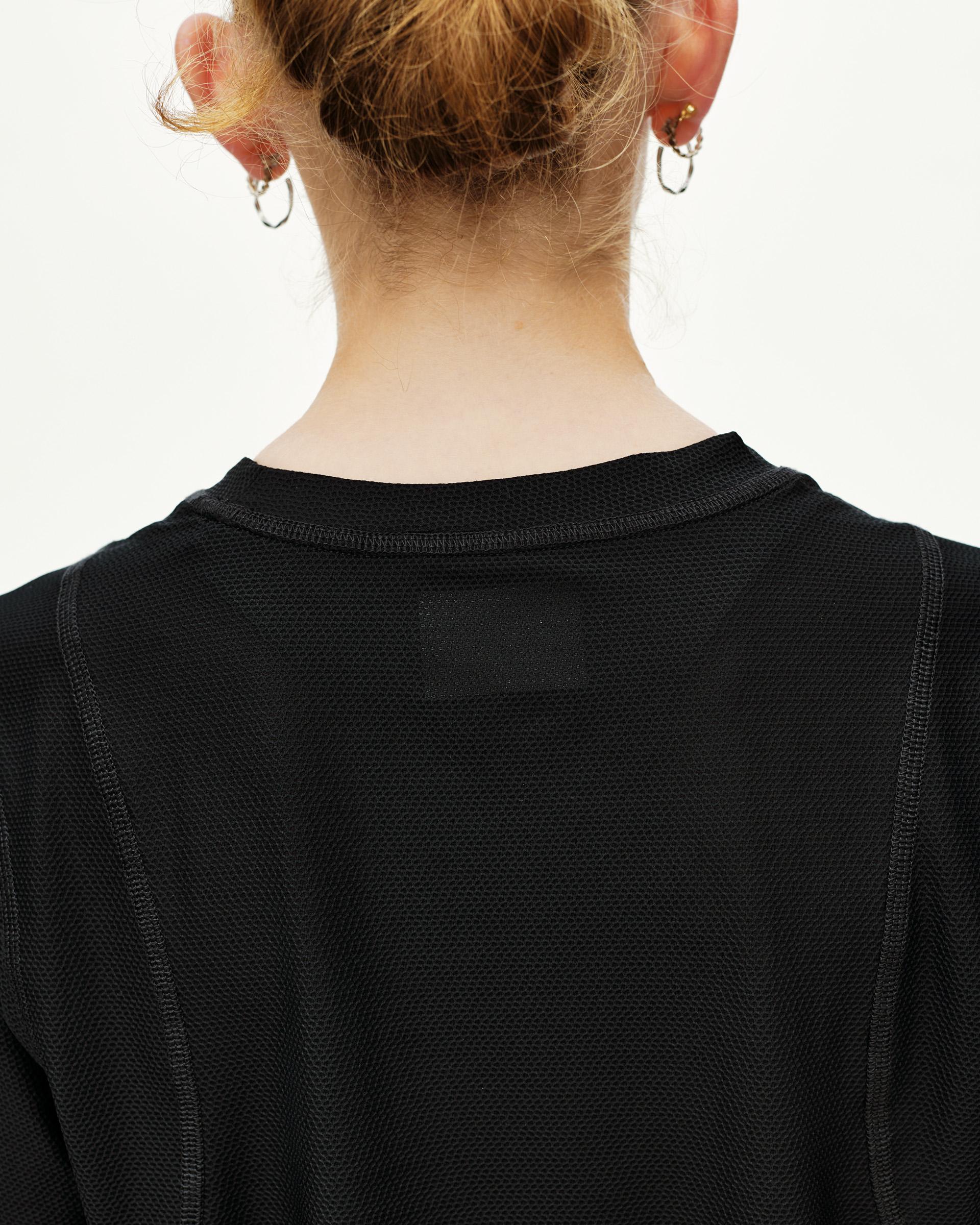 Black Balance T-shirt, rear detail on model showing mesh texture and crew neckline