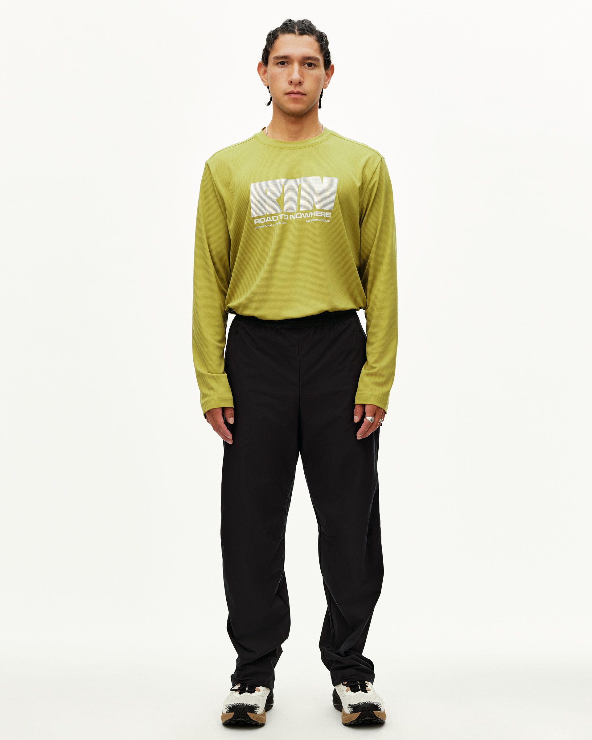 Black Balance performance pants on model, front view with elastic waistband and relaxed fit