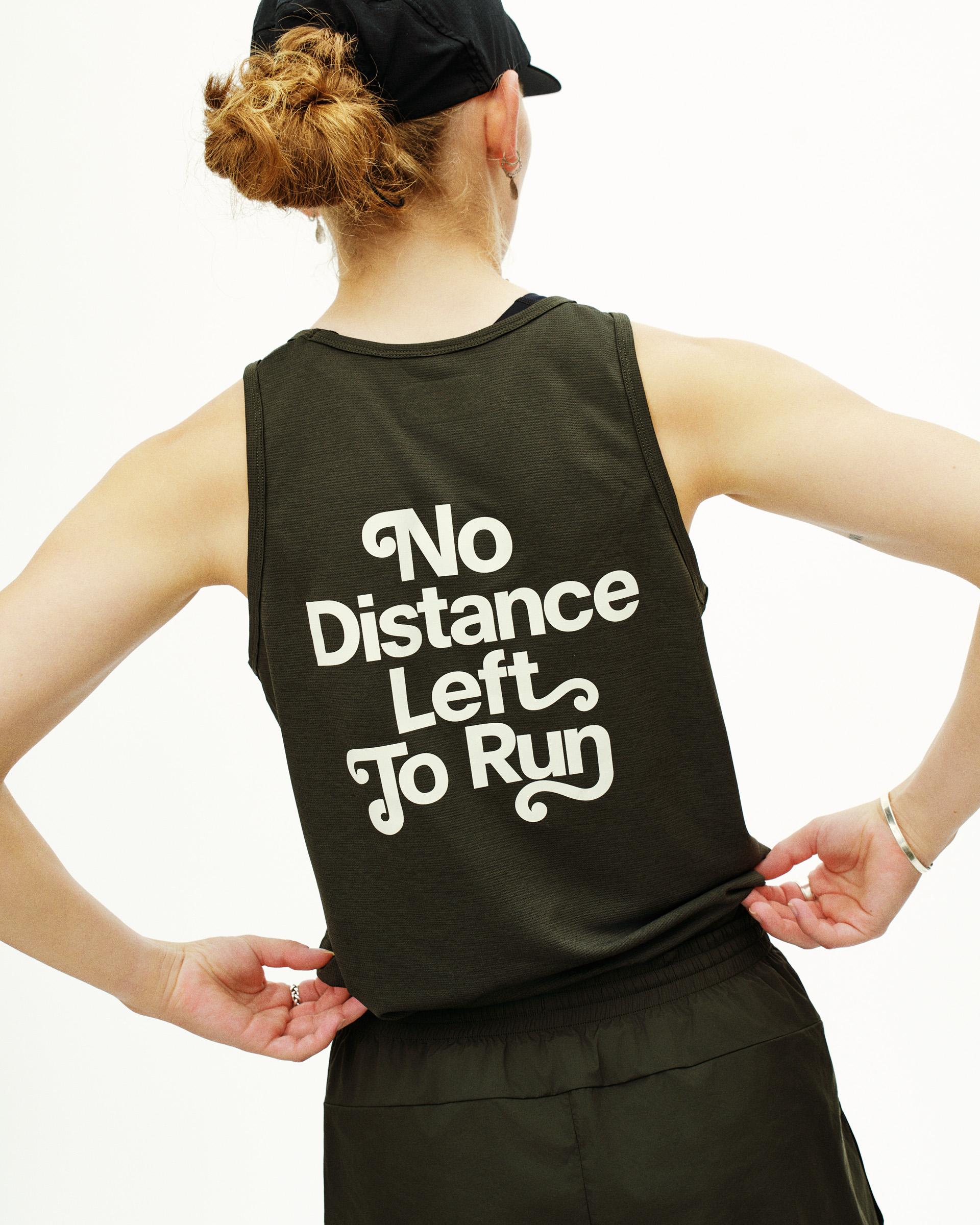 Dark Olive Balance singlet on model, rear view with white "No Distance Left To Run" text