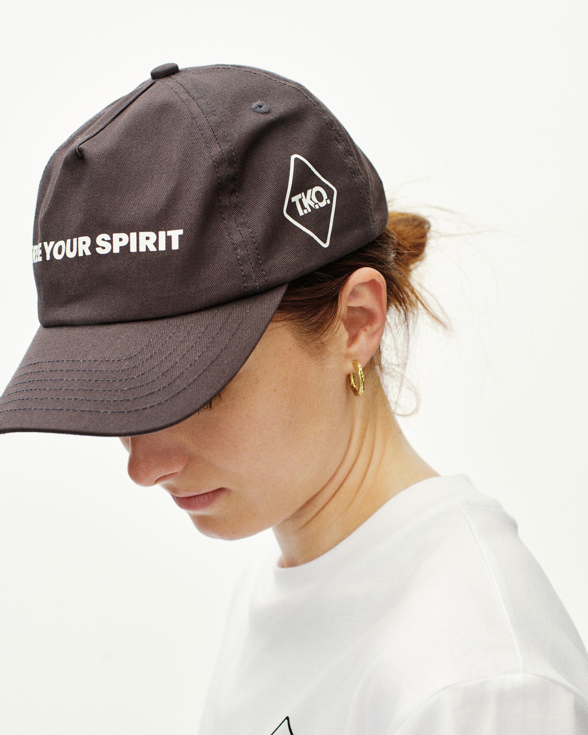 Dark Purple T.K.O. Off-Race cap on model, side view with white text print and diamond logo