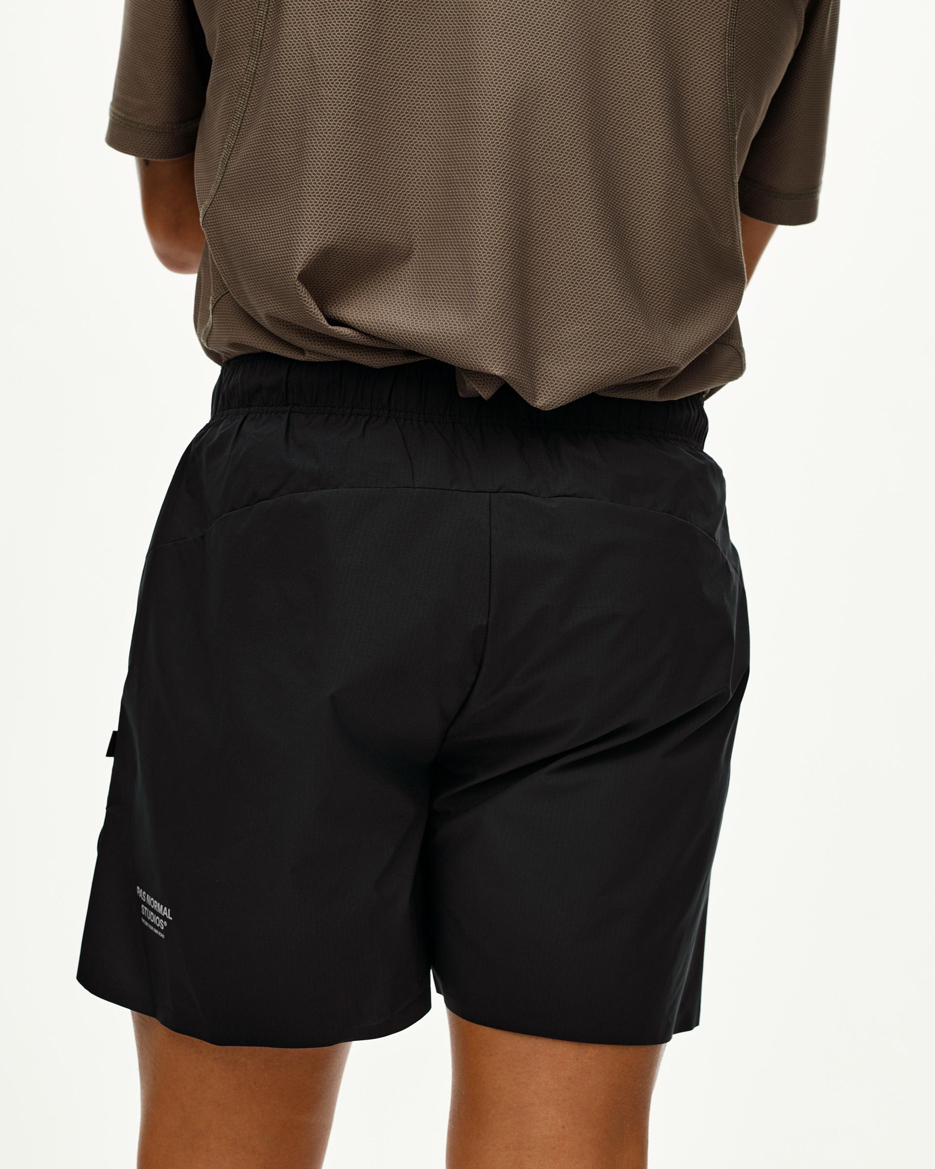 Black Balance shorts, rear view on model with elastic waistband and side pocket