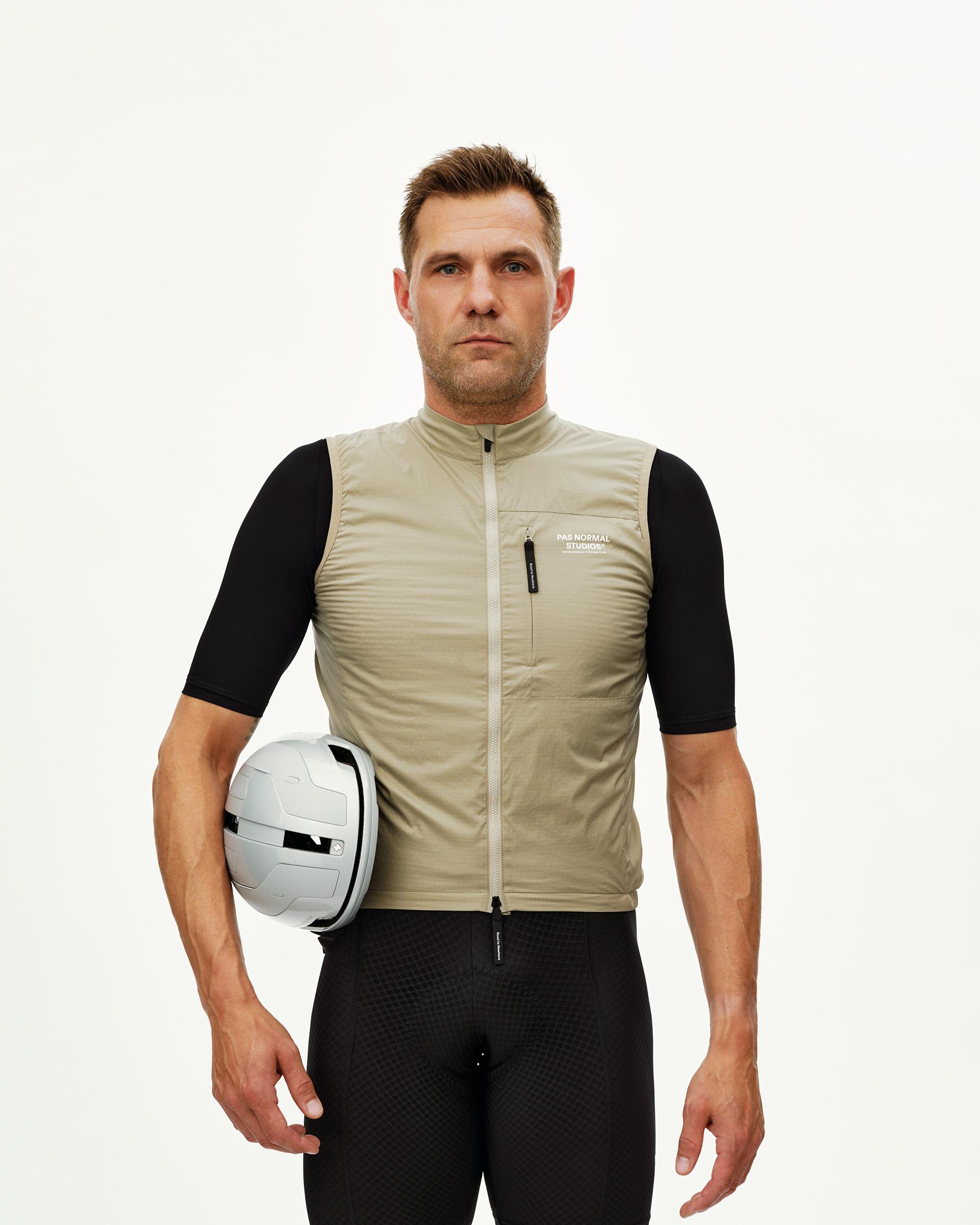 Grey Sage Essential cycling gilet on model, front view with chest zip pocket and full-length zip