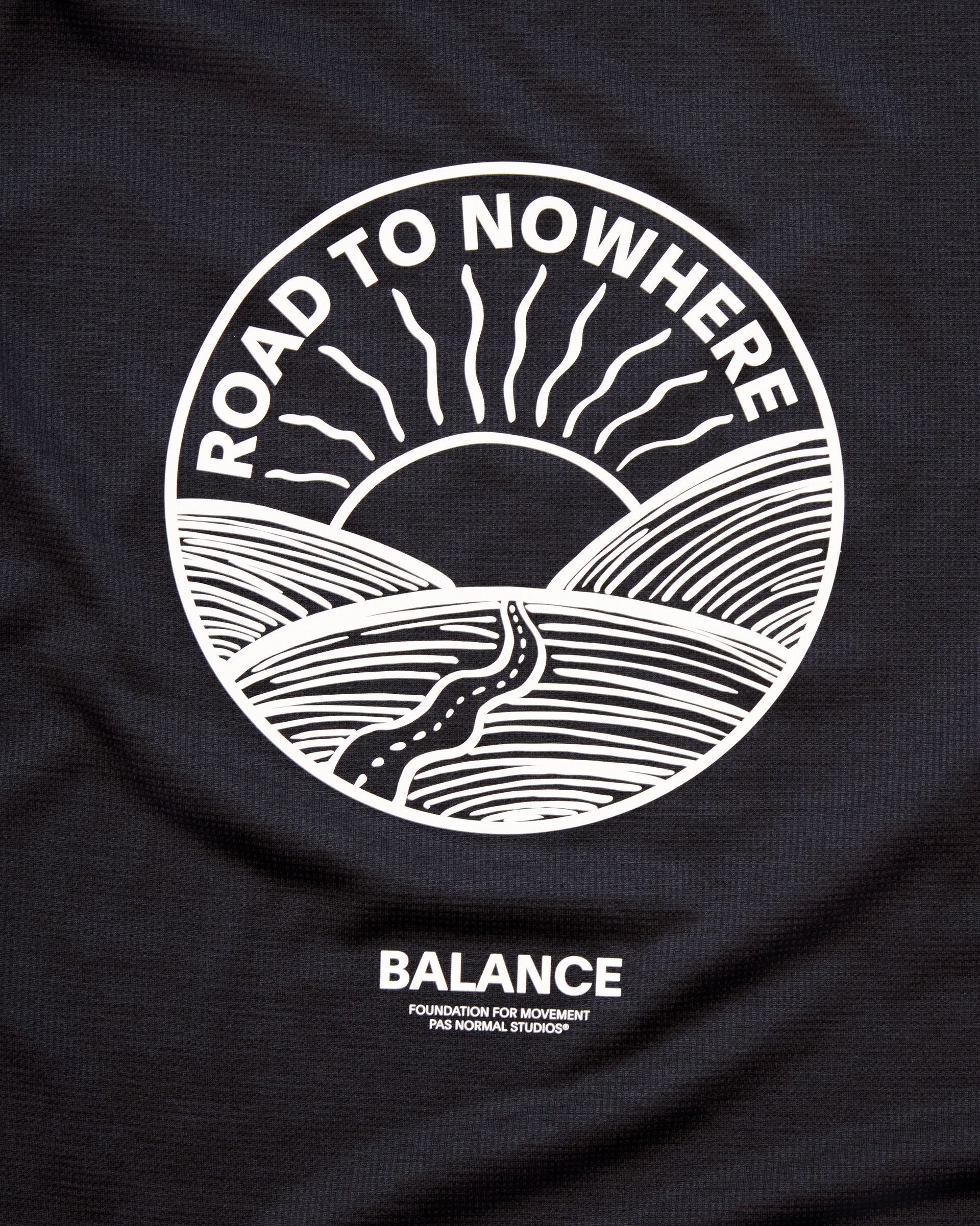 Black Balance singlet with white Road to Nowhere circular graphic and Balance logo