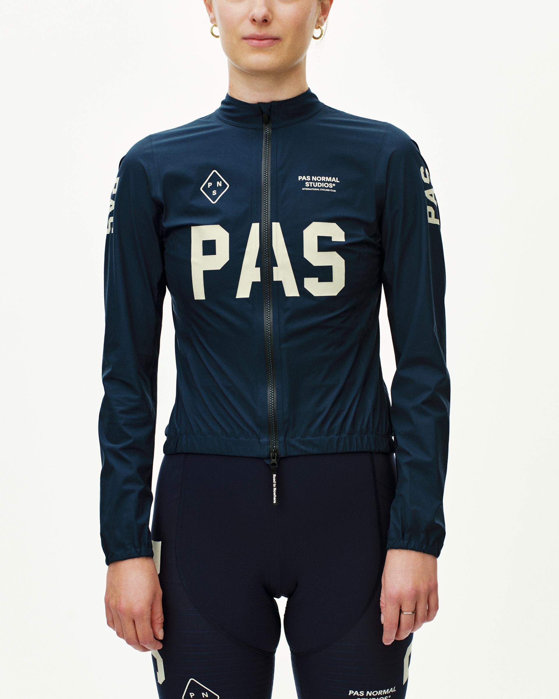 Navy PAS Mechanism Rain cycling jacket on model with large white chest print
