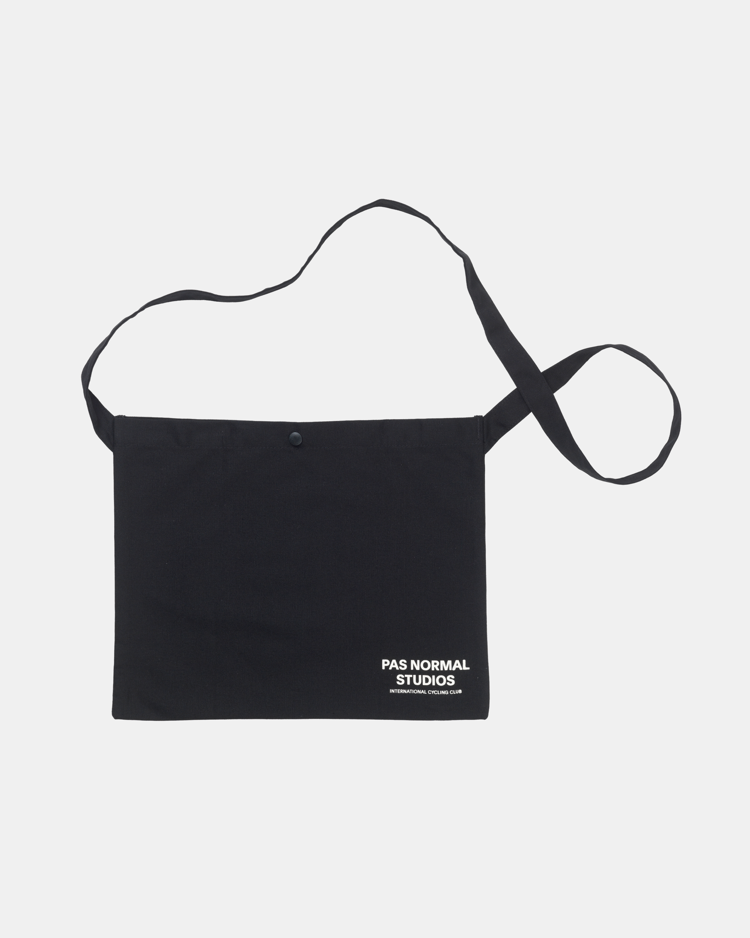 Black Off-Race musette, front flat lay with snap closure and white logo print