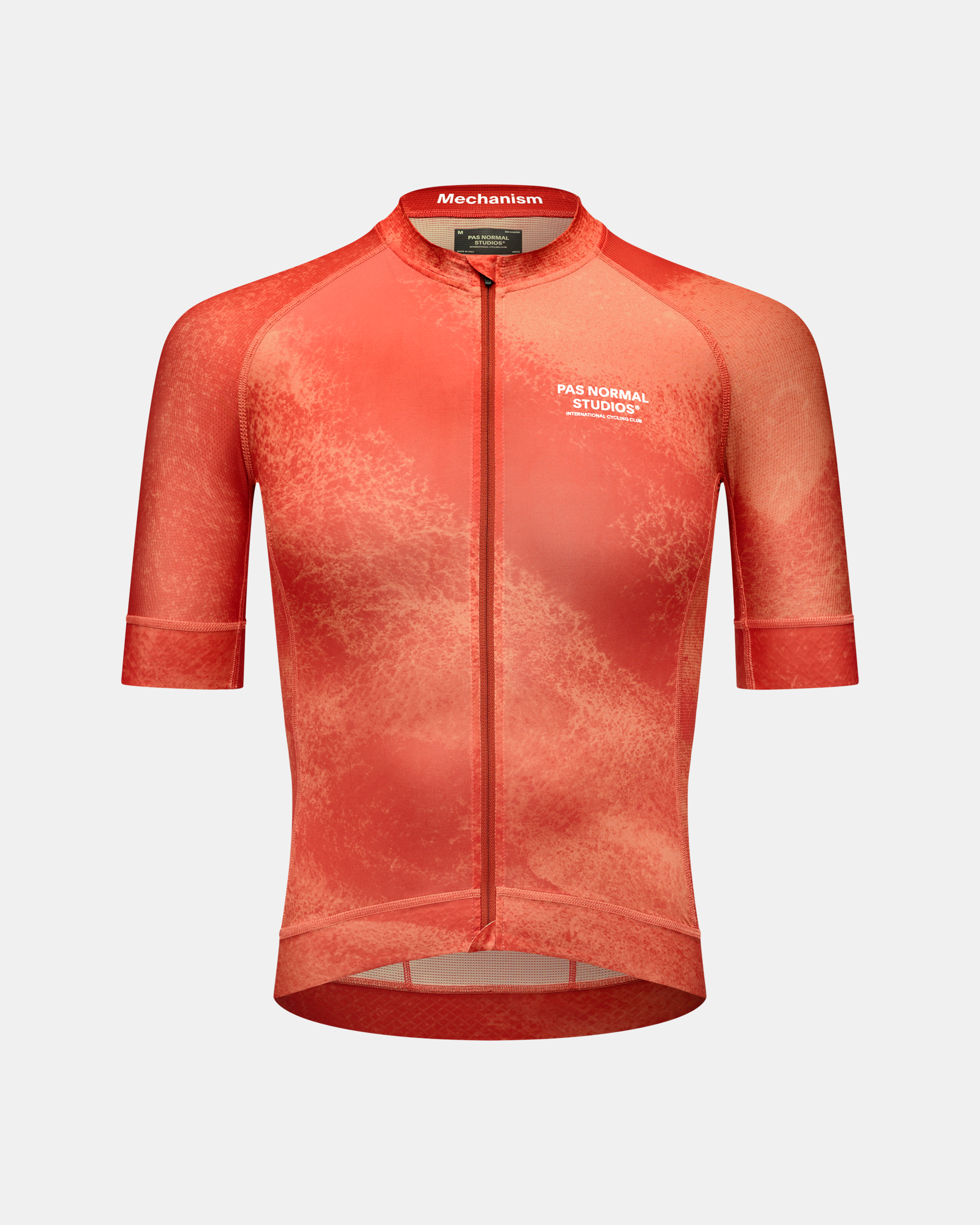 Orange Mechanism cycling jersey front view with speckled gradient pattern