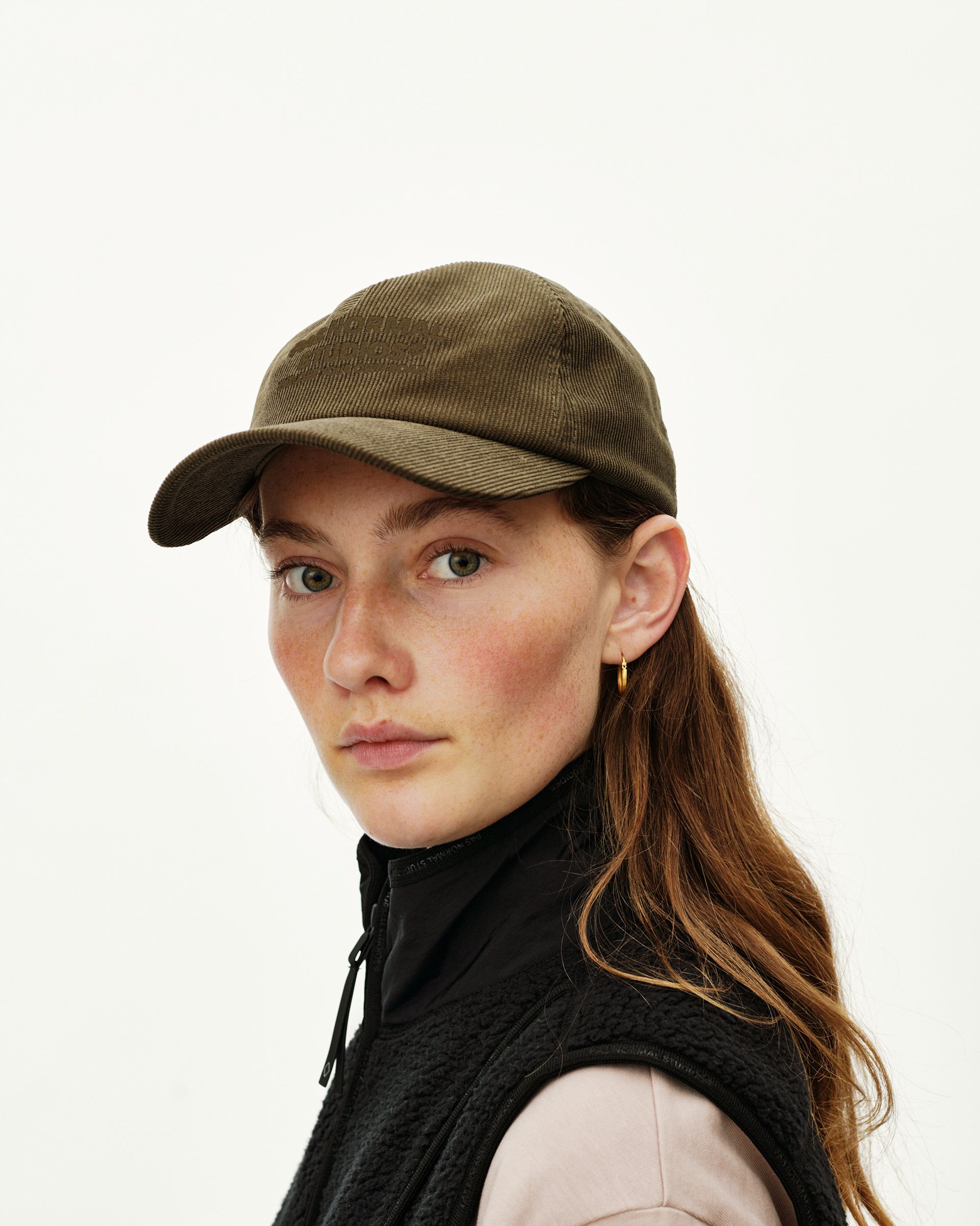 Deep Olive Off-Race Tech Corduroy cap on model, front three-quarter view with tonal embroidered logo