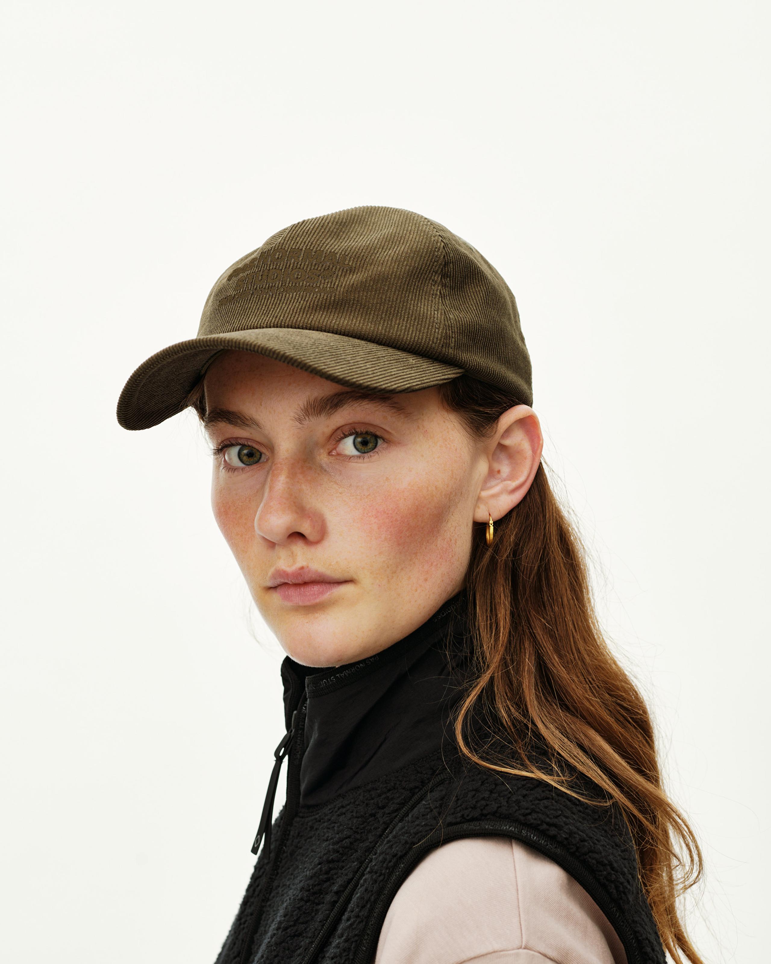 Deep Olive Off-Race Tech Corduroy cap on model, front three-quarter view with tonal embroidered logo