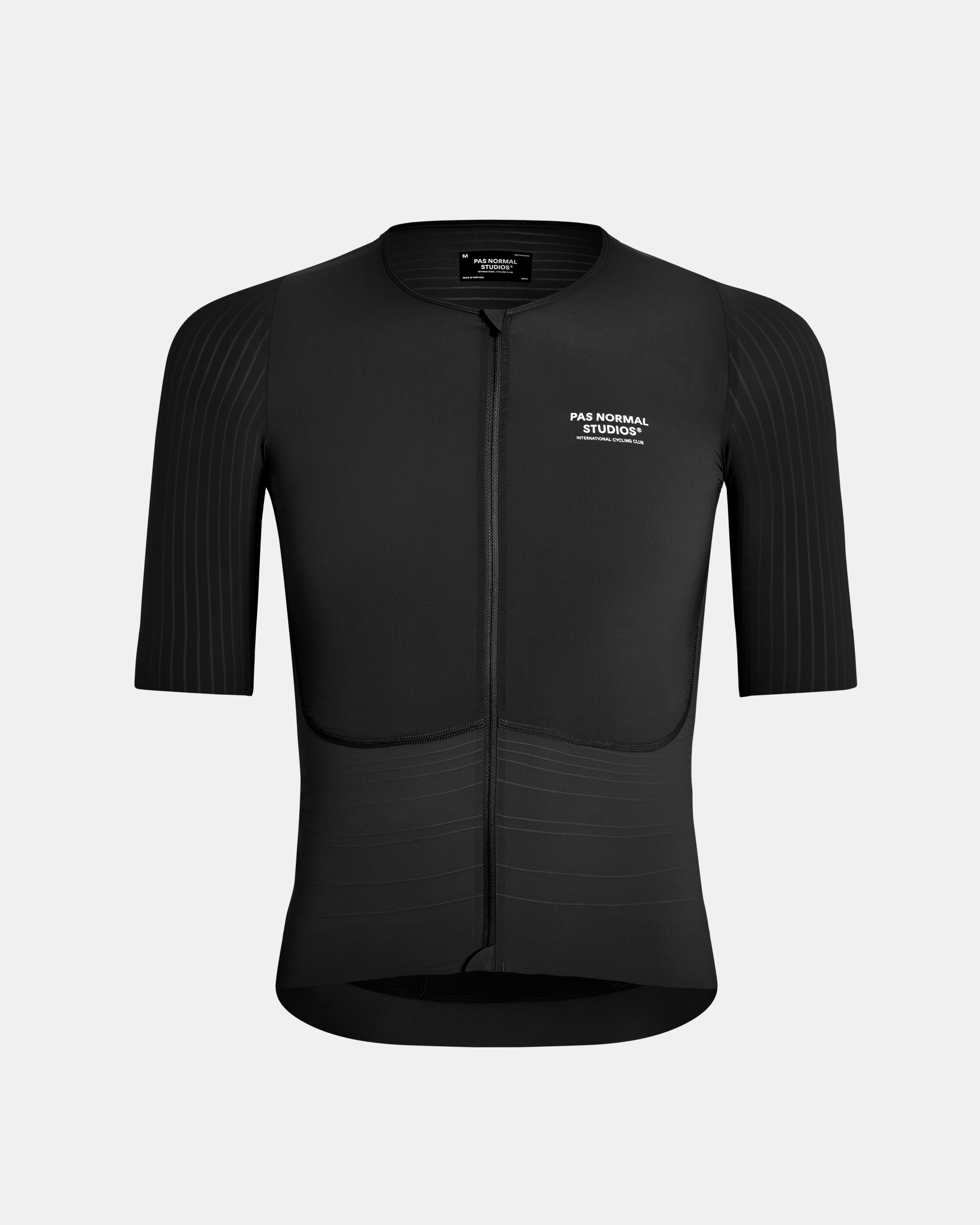 Black Mechanism Pro cycling jersey, front view with ribbed sleeves and textured lower panel