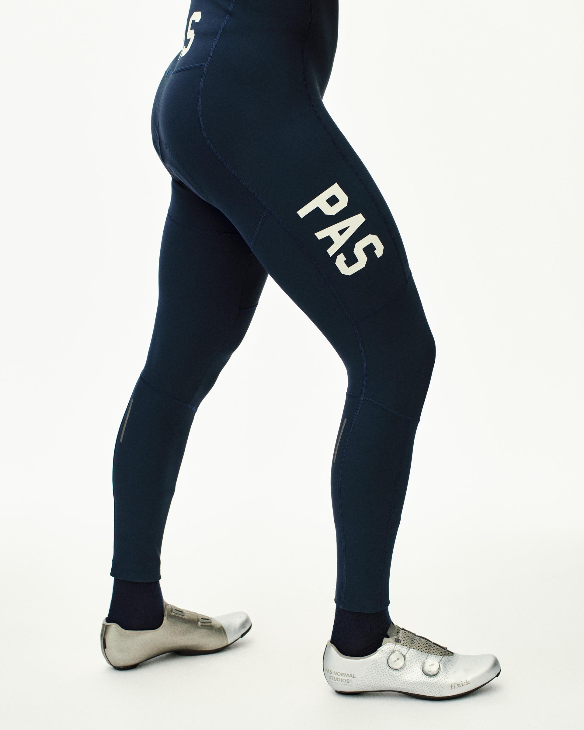 Navy PAS Mechanism Deep Winter Long Bibs on model, side view with white leg print