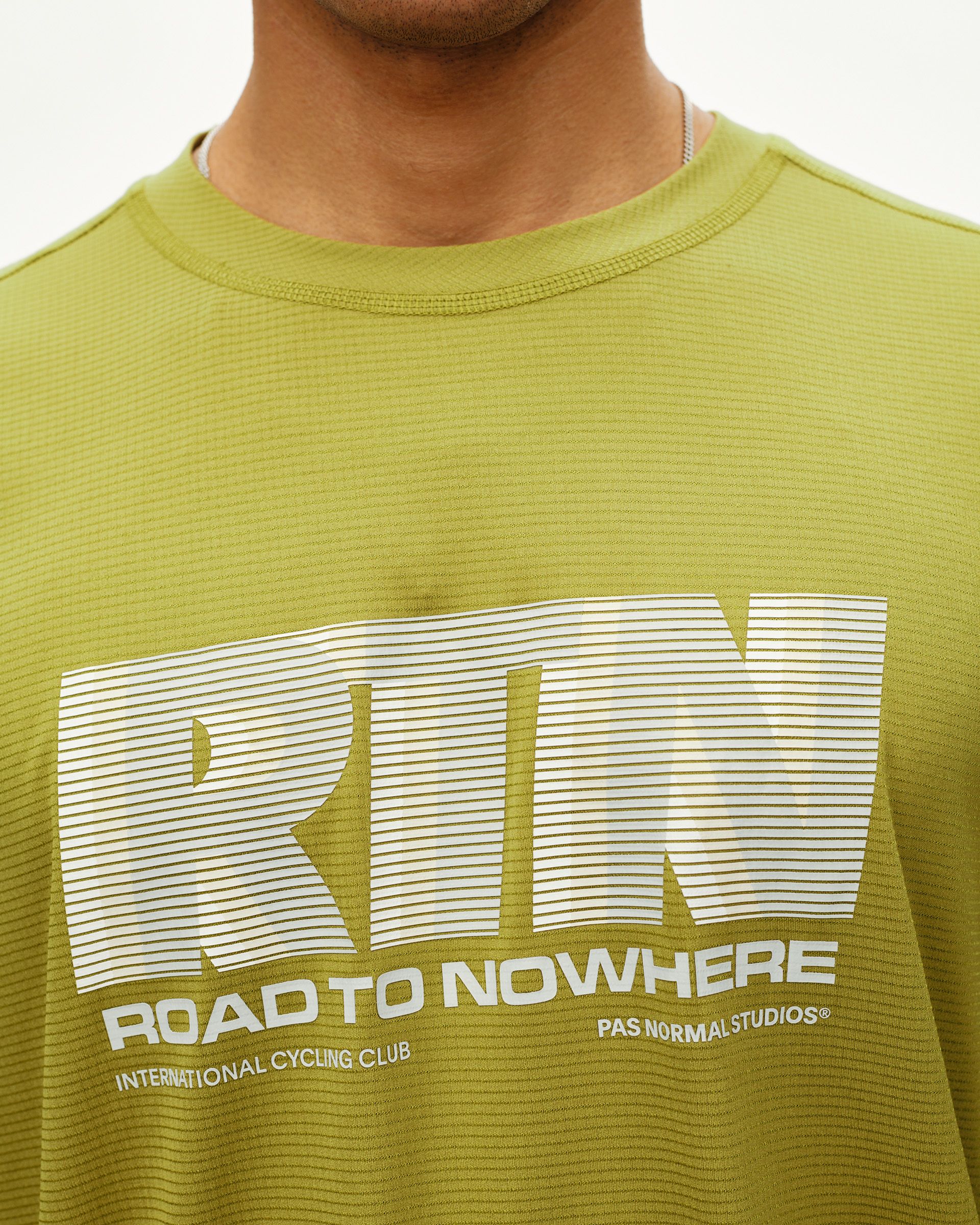 Dark Lime Balance long sleeve T-shirt, front detail on model with white RTN Road To Nowhere chest print