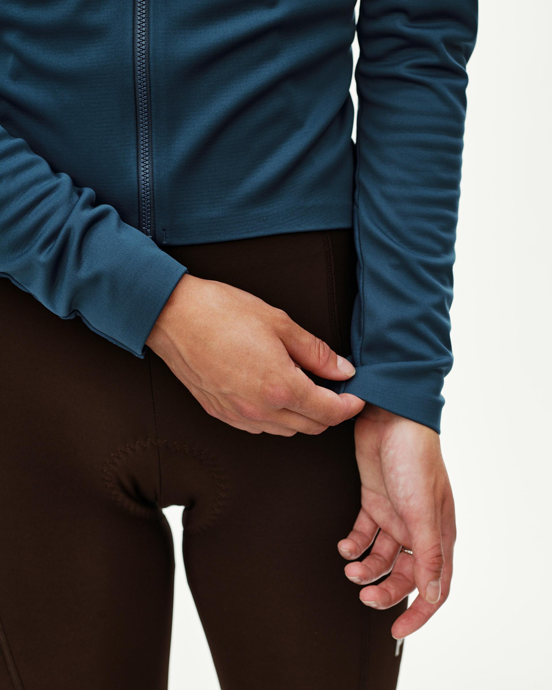 Denim Blue Mechanism Thermal Long Sleeve cycling jersey on model, front detail view with full-length zip