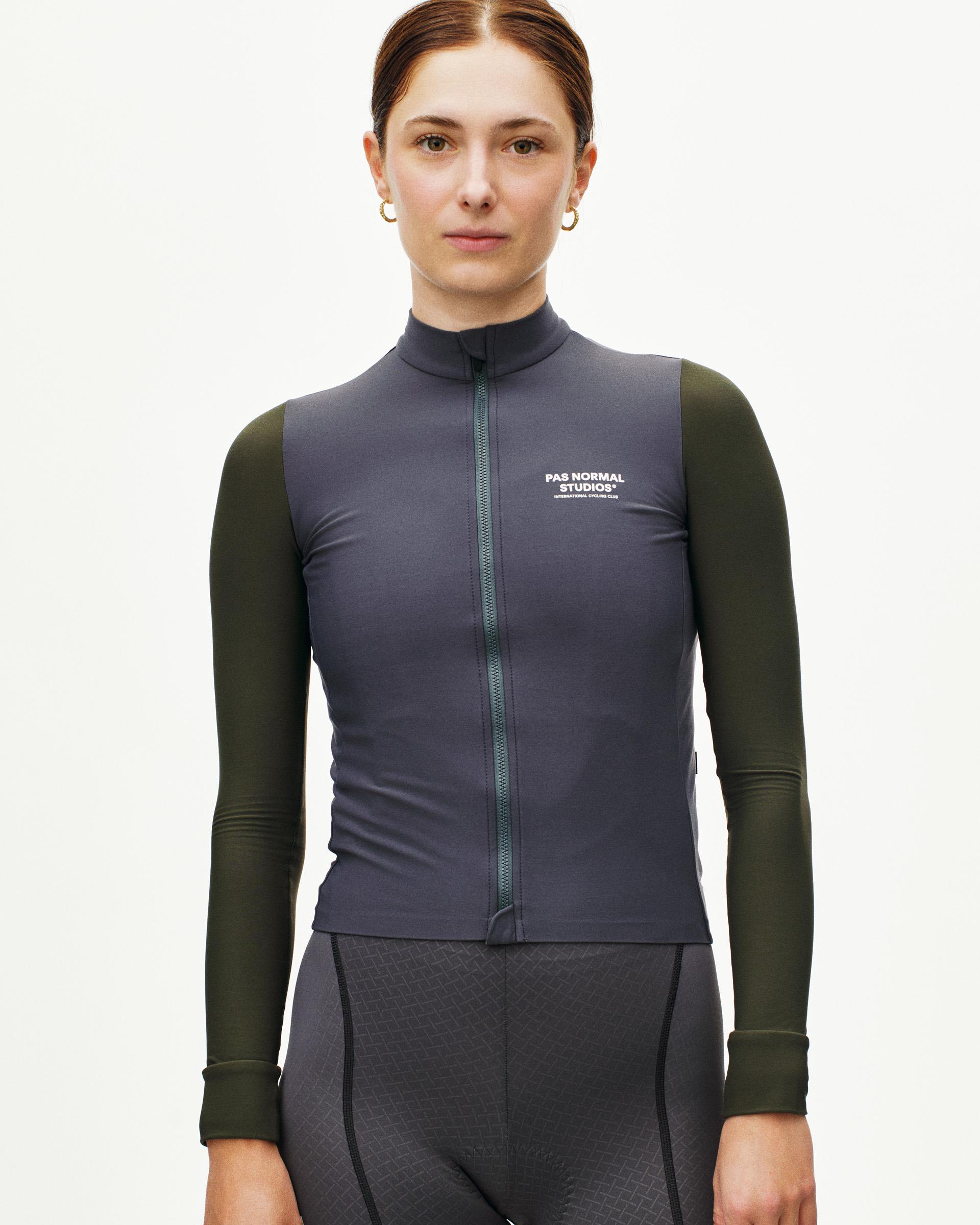 Grey Mechanism long sleeve cycling jersey on model with olive sleeves and full zip