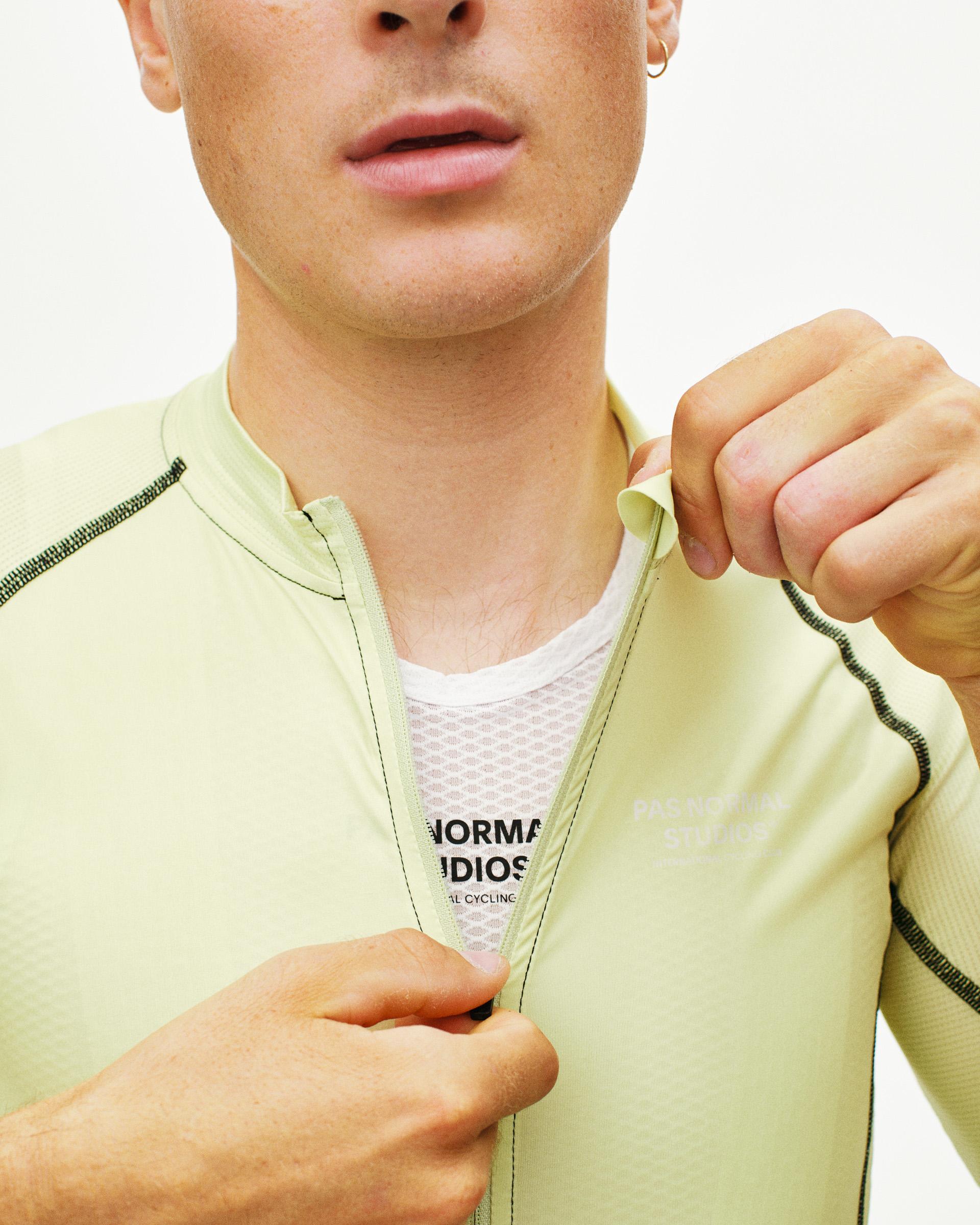 Lime Mechanism cycling jersey on model with contrast stitching and mesh base layer