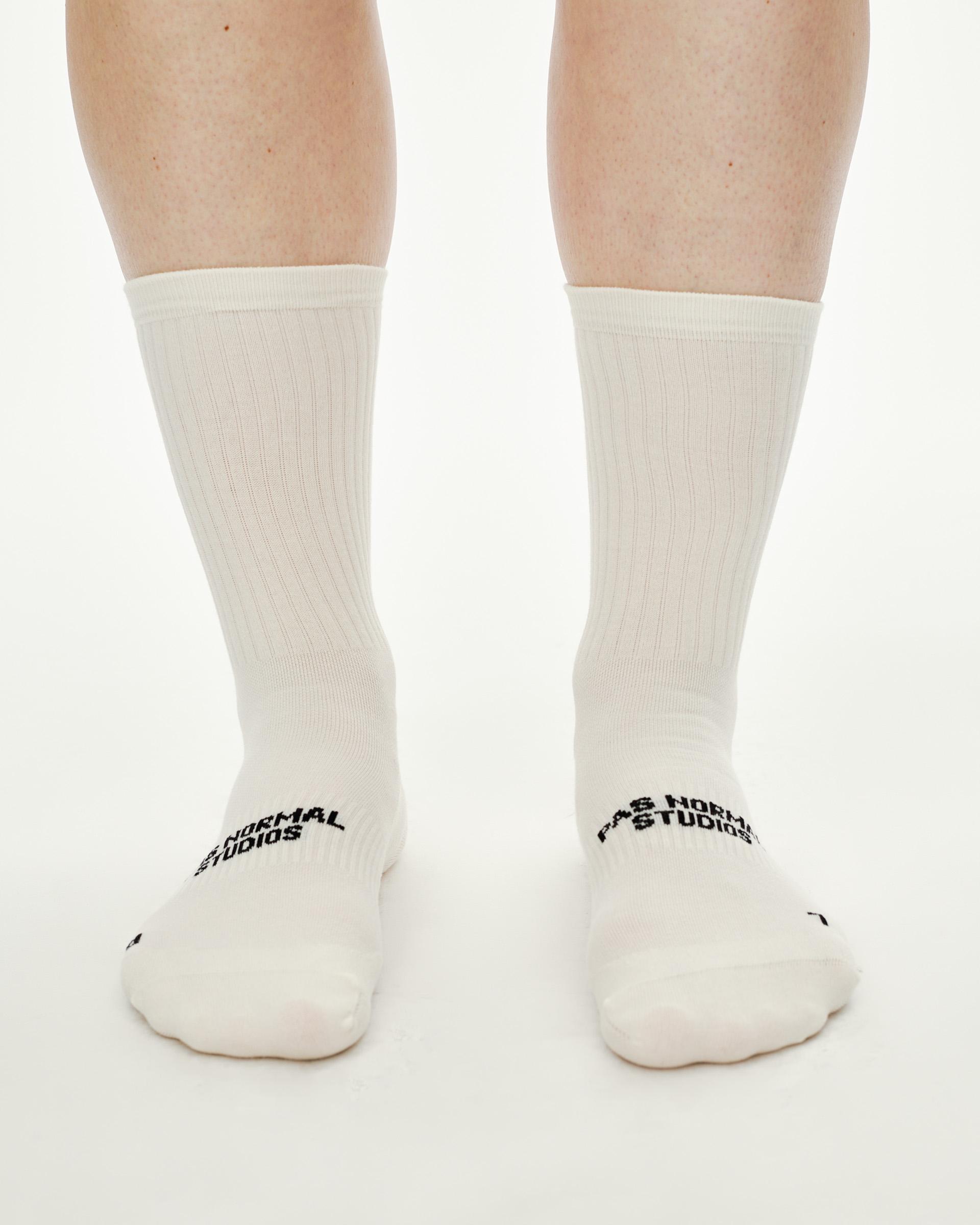 Off White Off-Race cycling socks on model, front view with black logo at instep