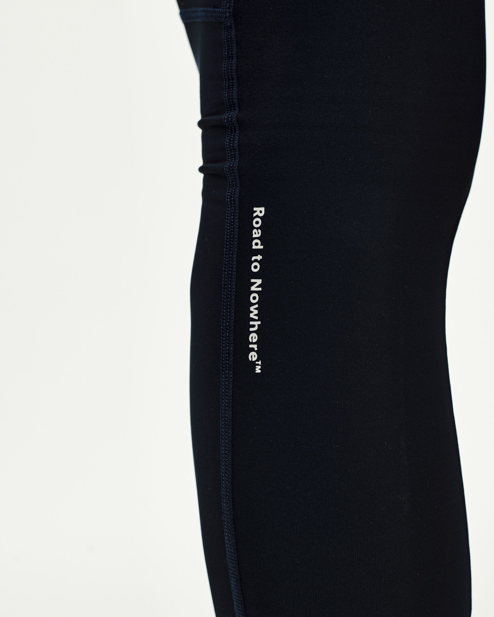 Navy Mechanism Thermal Long cycling bibs, side detail view with white Road to Nowhere leg print