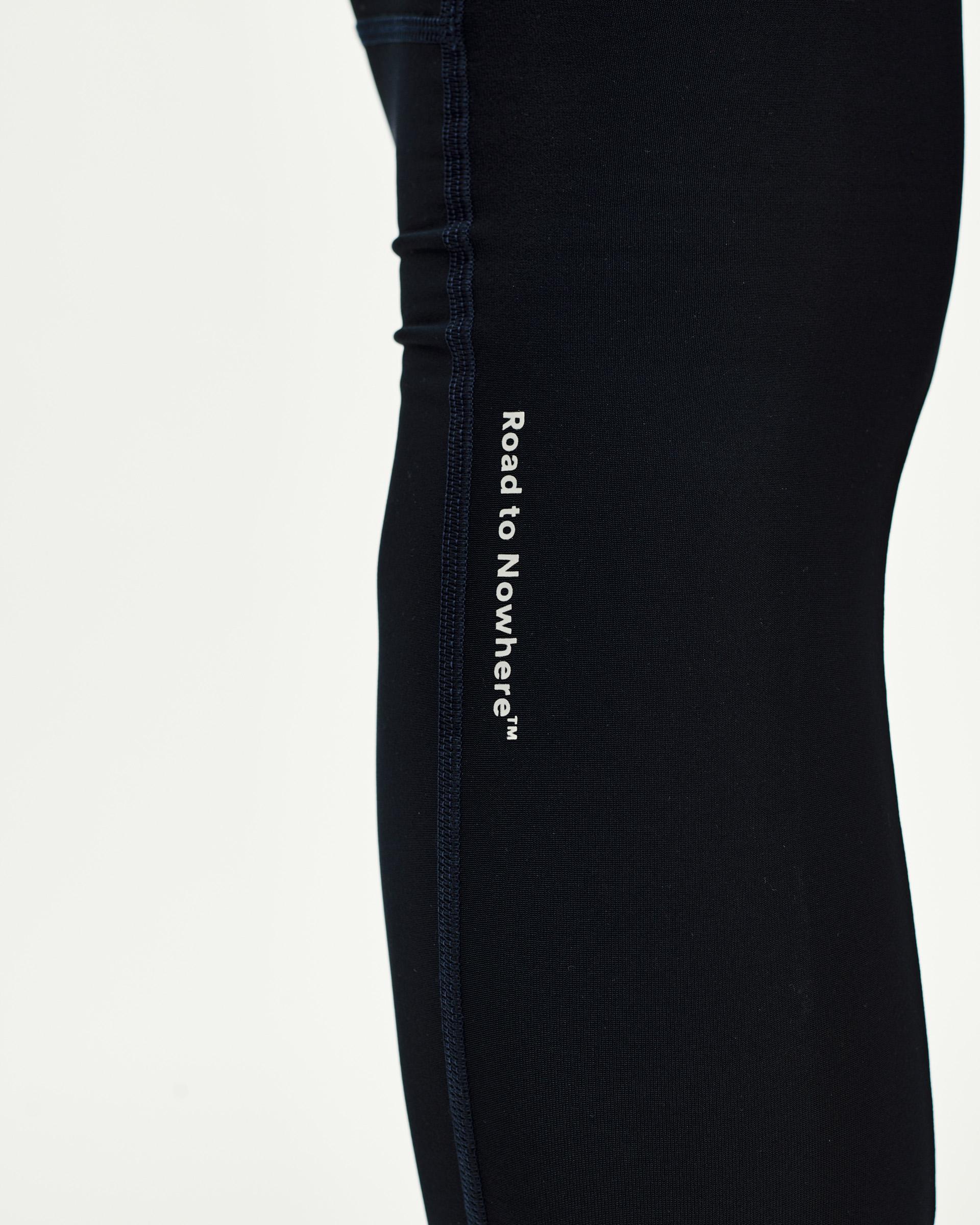Navy Mechanism Thermal Long cycling bibs, side detail view with white Road to Nowhere leg print