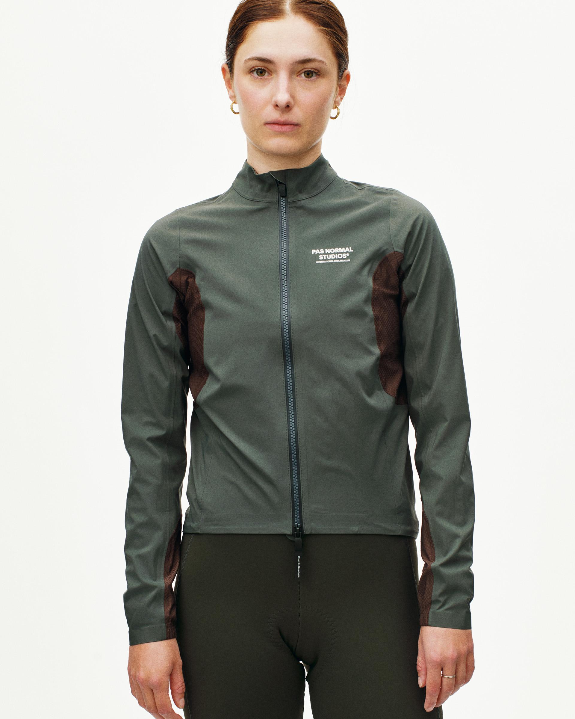 Dark Grey Mechanism Shell cycling jacket on model with mesh side panels