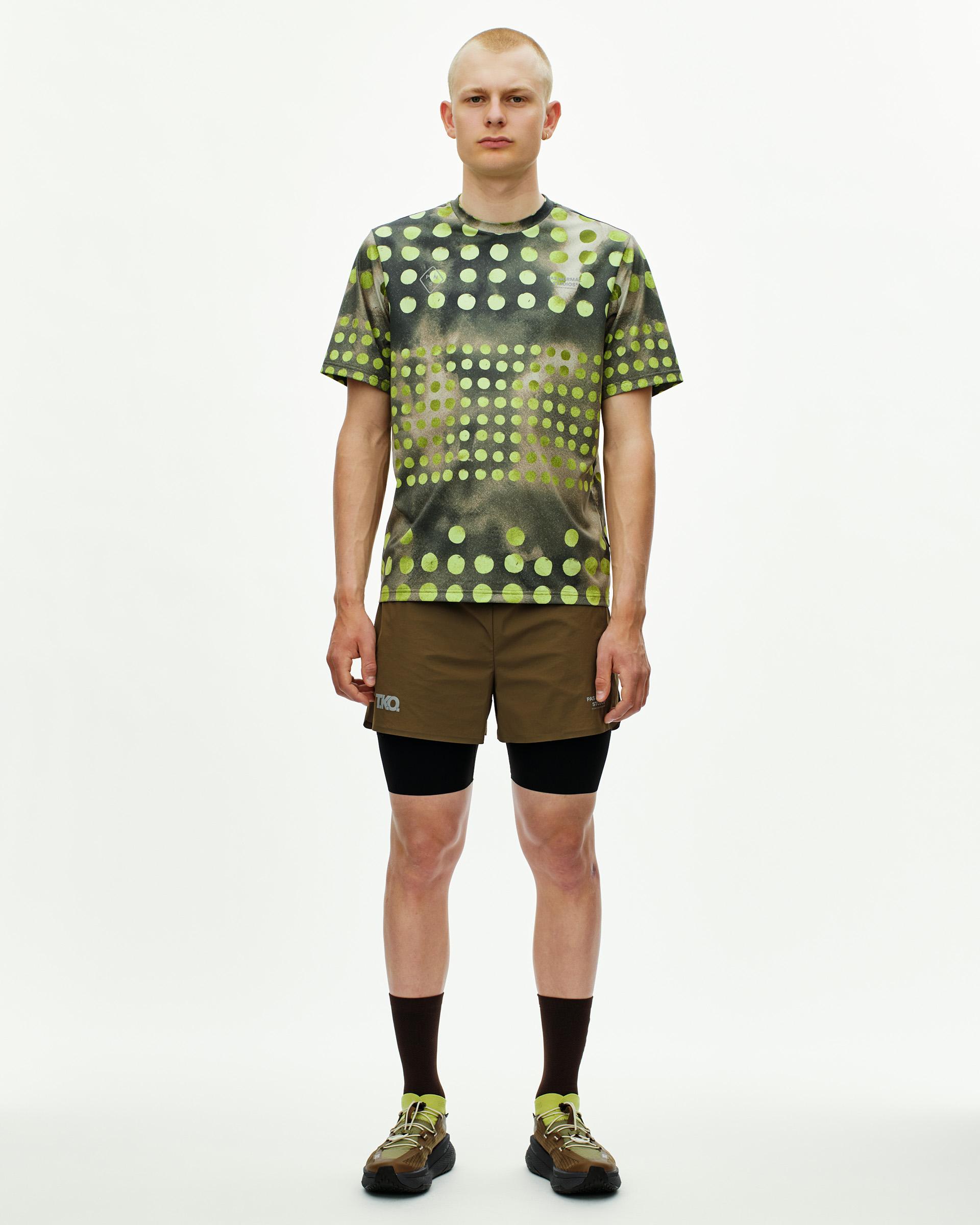 Green Salomon GRVL CONCEPT t-shirt on model with geometric dot print