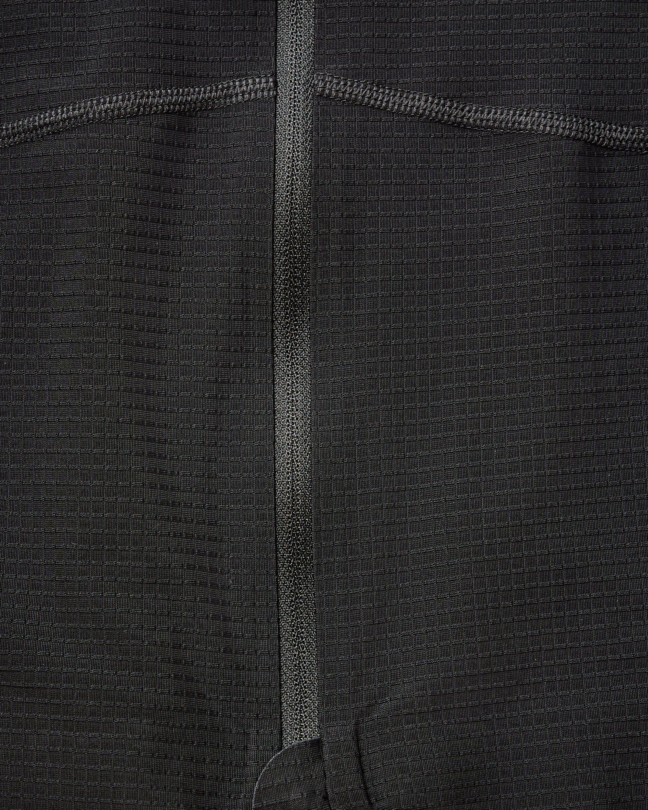 Grey Mechanism Pro long sleeve cycling jersey, detail view with contrast stitching and center seam